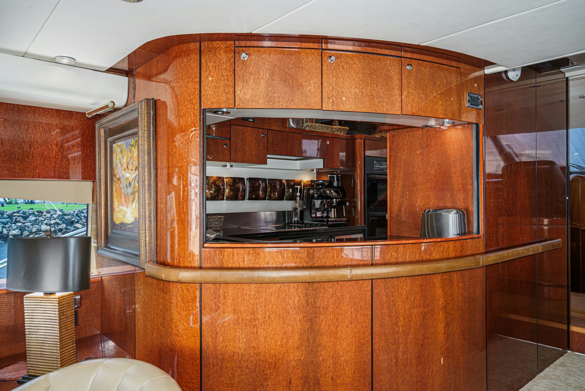 a kitchen with wooden cabinets aboard COMPASS ROSE Yacht for Sale