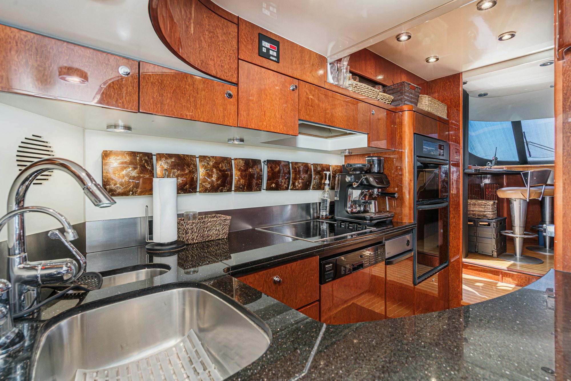 a kitchen with a large island aboard COMPASS ROSE Yacht for Sale