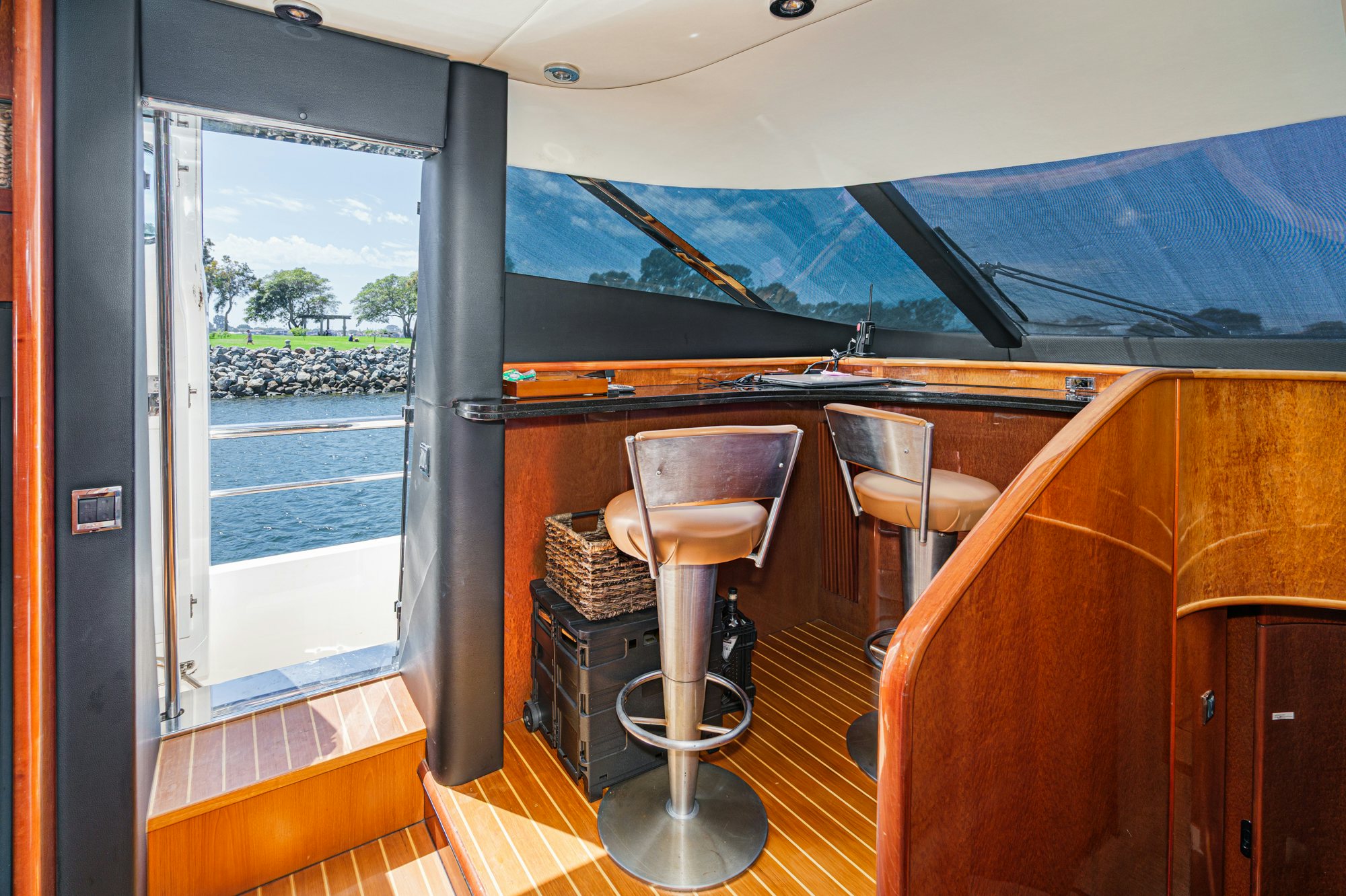 a room with a table and chairs aboard COMPASS ROSE Yacht for Sale