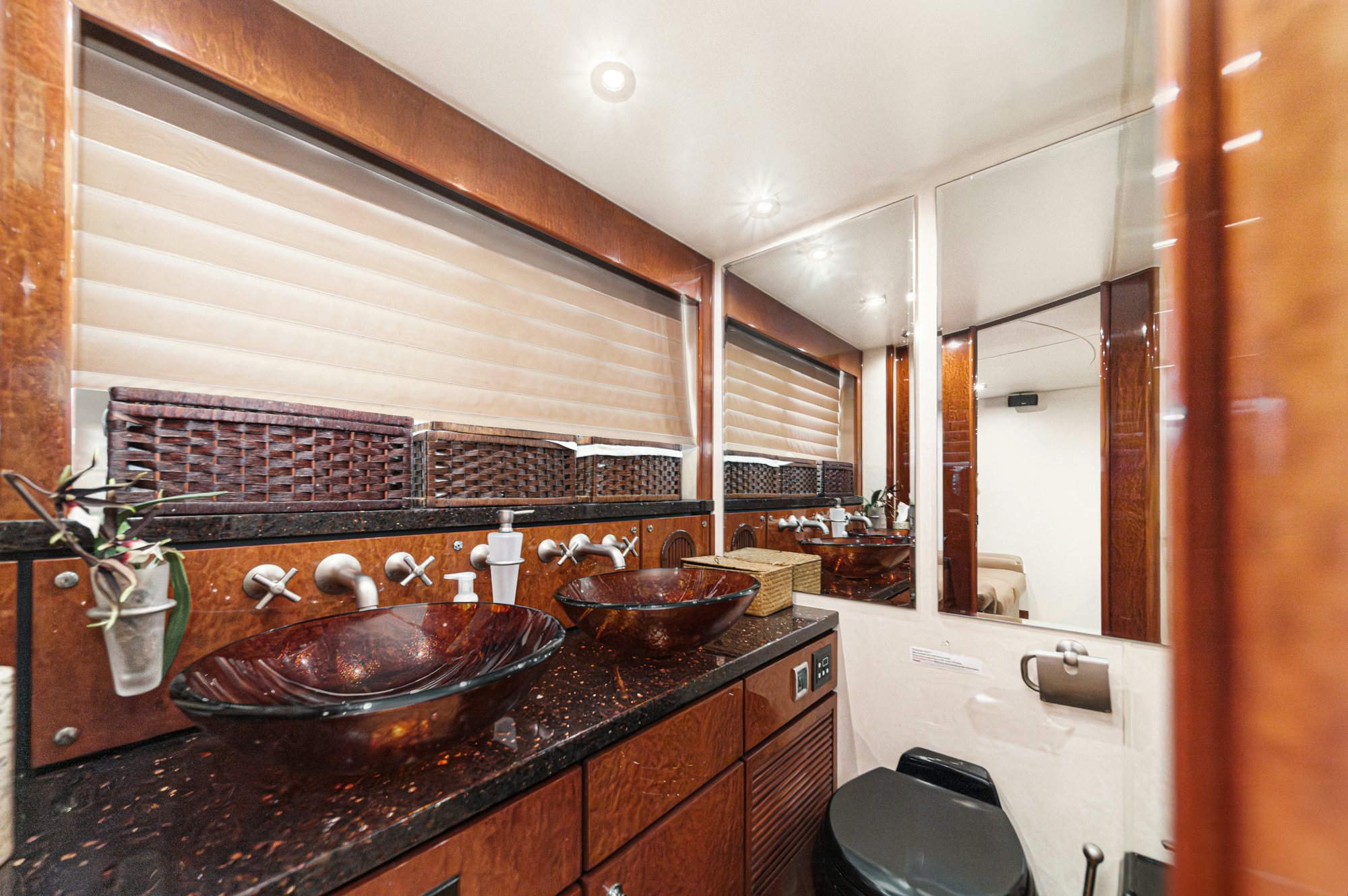 a kitchen with a sink and a large mirror aboard COMPASS ROSE Yacht for Sale