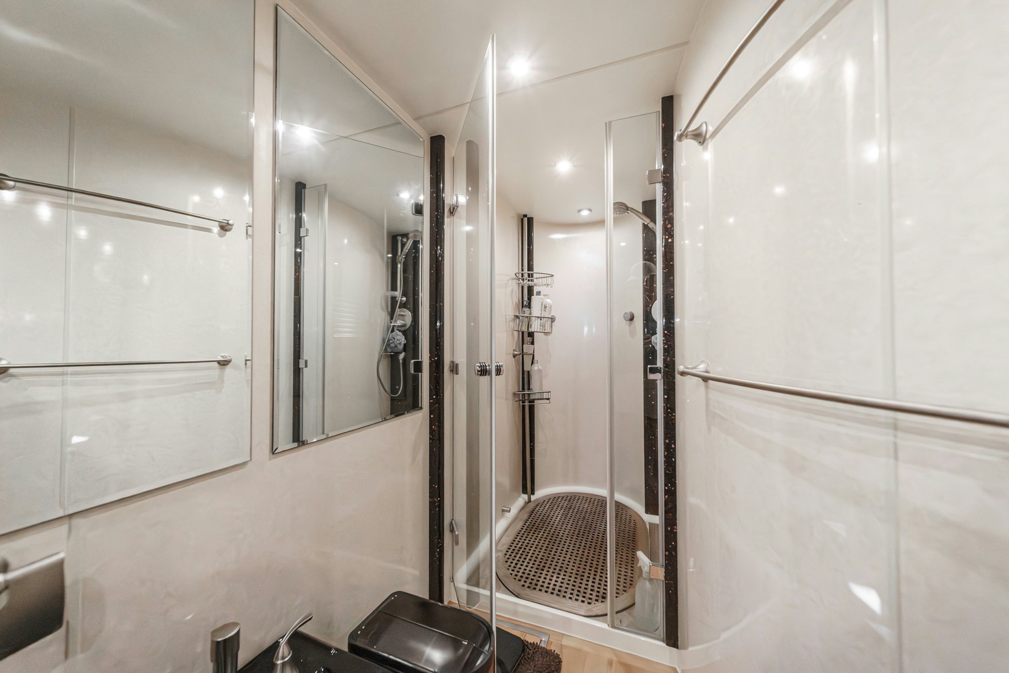 a bathroom with a shower unit aboard COMPASS ROSE Yacht for Sale