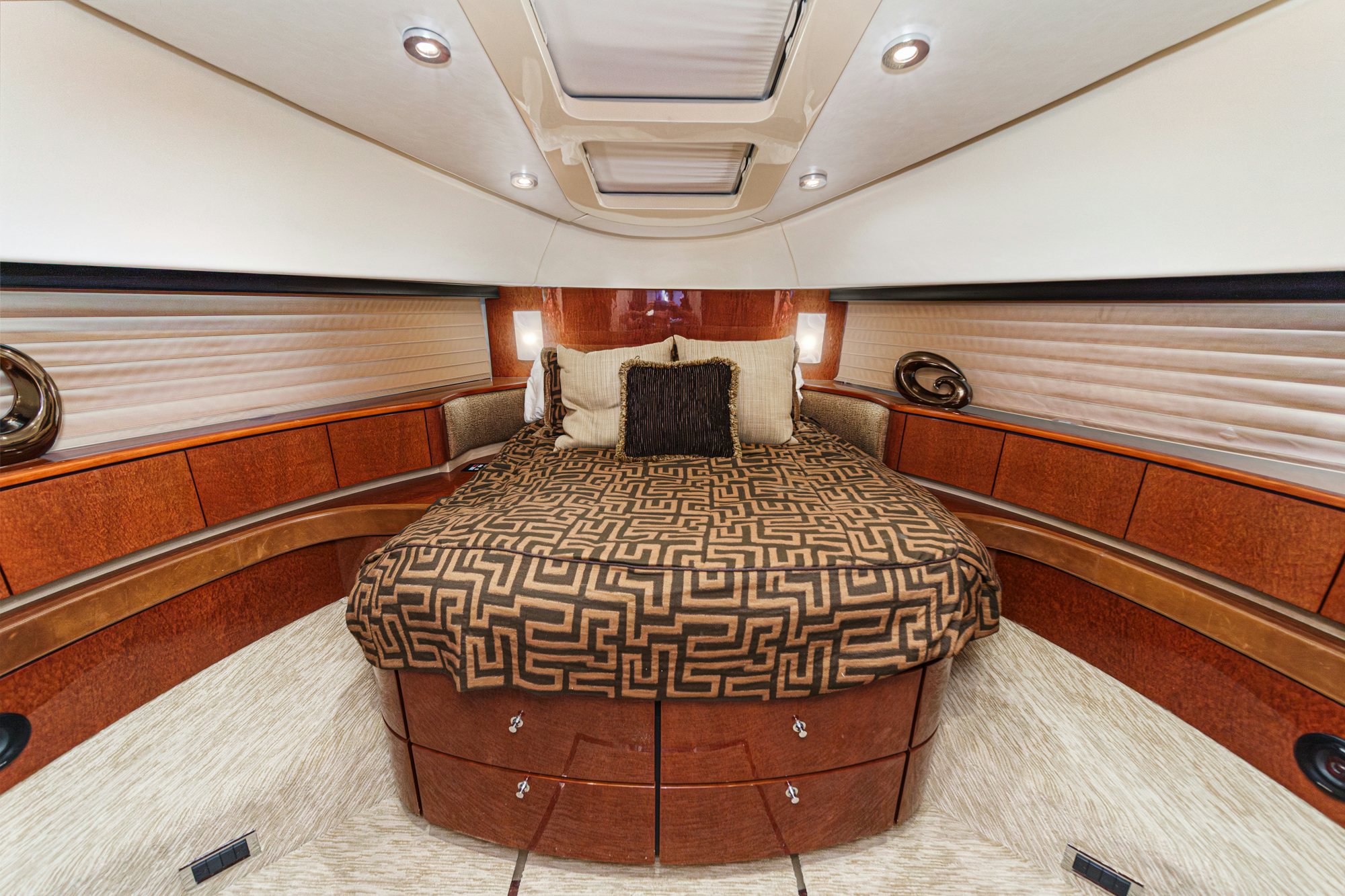 a bed with a wooden frame aboard COMPASS ROSE Yacht for Sale