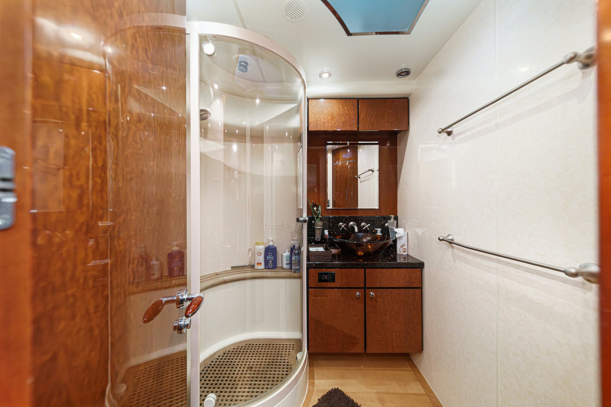 a bathroom with a shower and sink aboard COMPASS ROSE Yacht for Sale