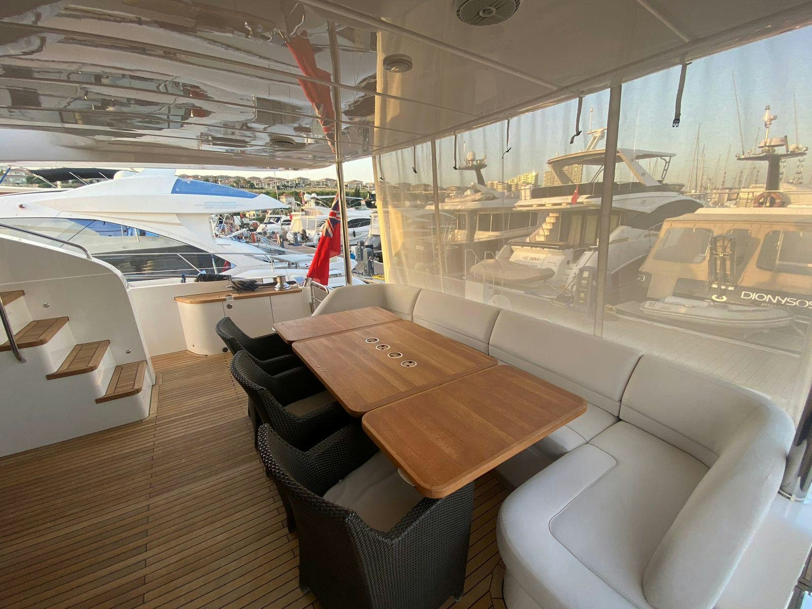 inside of a building with a table and chairs aboard VIXEN Yacht for Sale