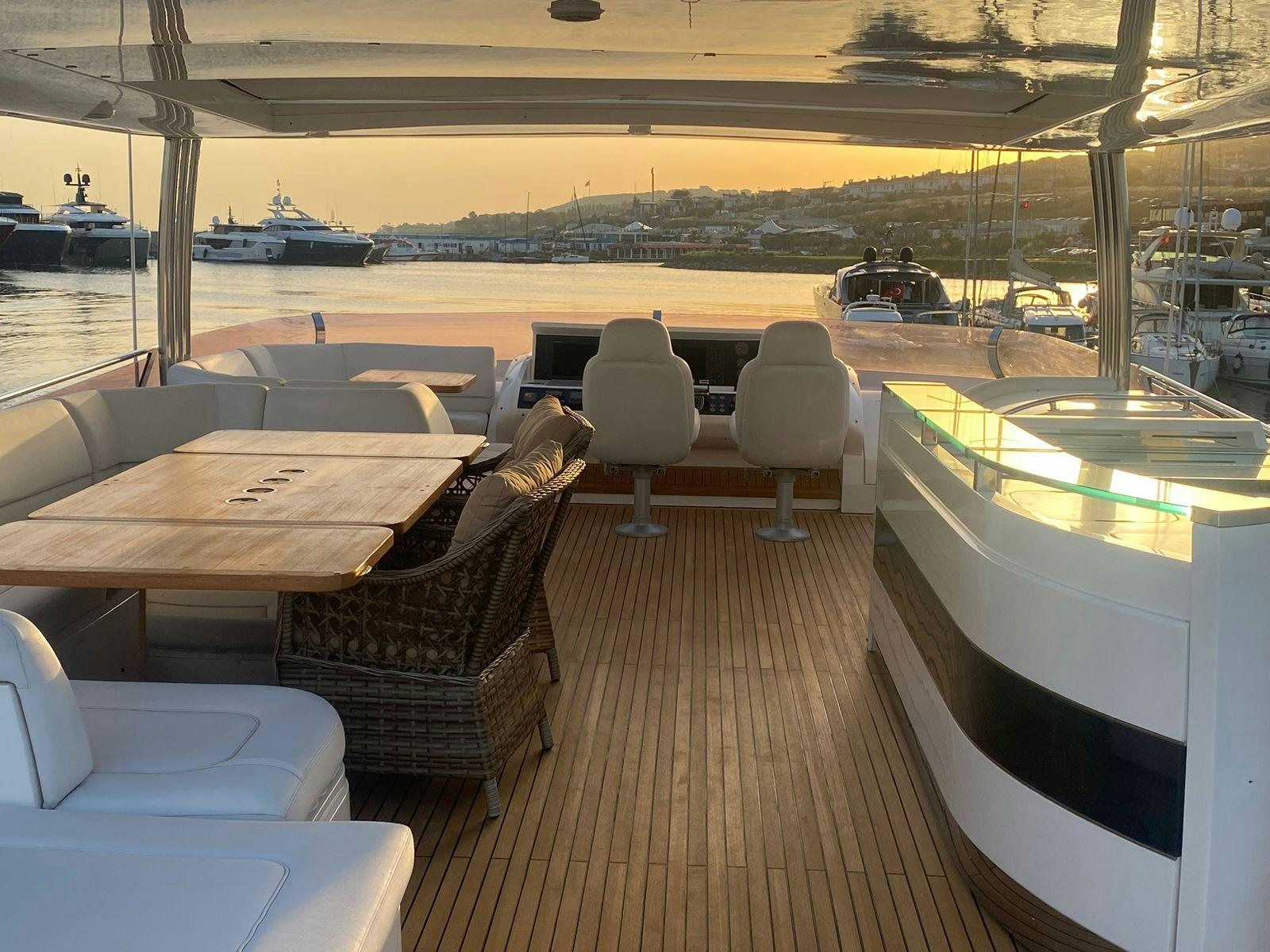 a boat dock with chairs and tables aboard VIXEN Yacht for Sale