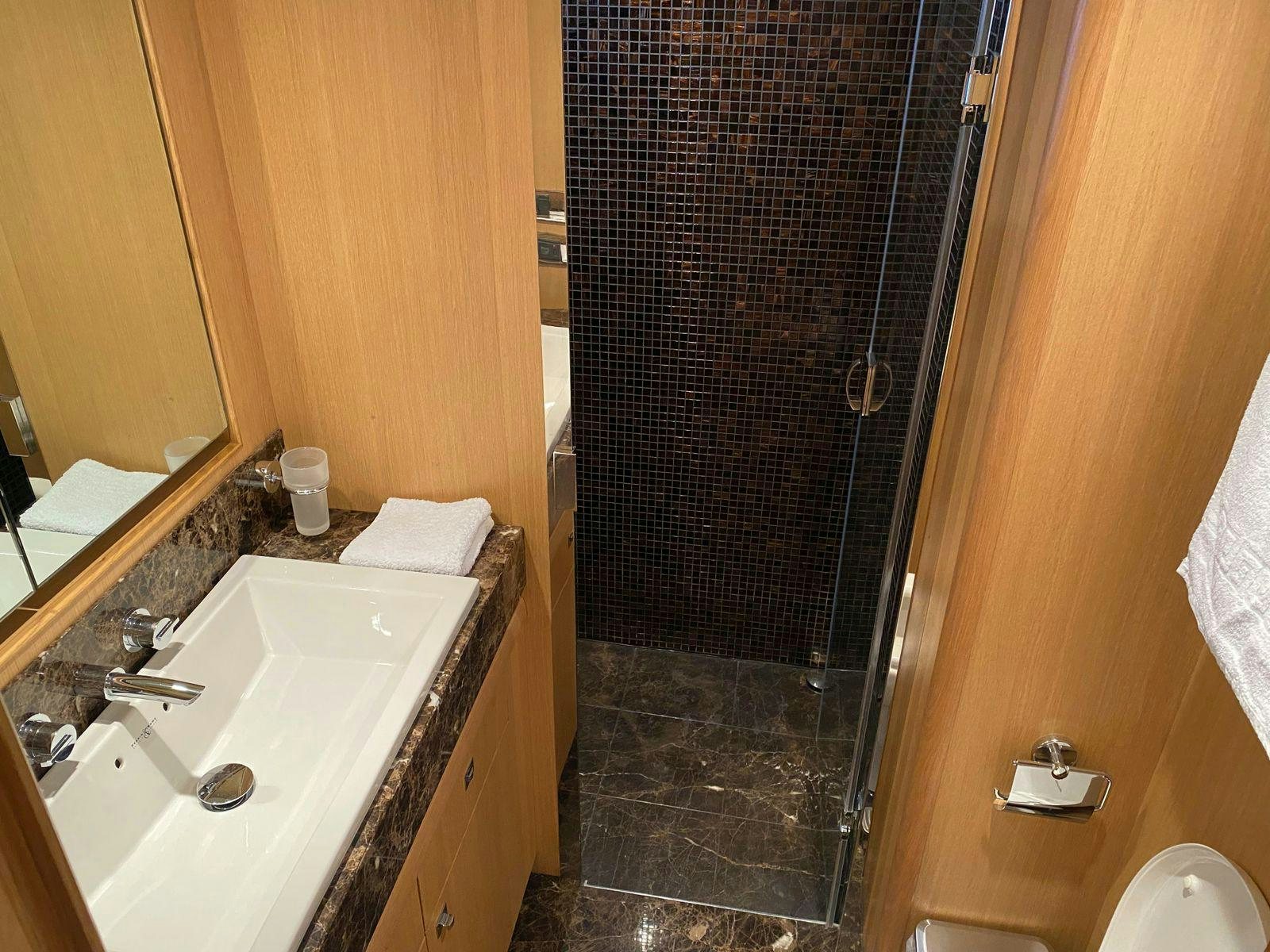 a bathroom with a shower and sink aboard VIXEN Yacht for Sale