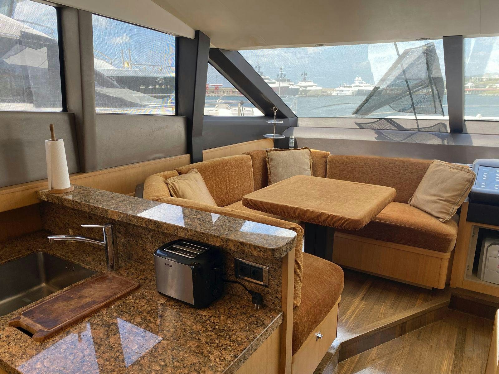 a living room with a couch and a coffee table aboard VIXEN Yacht for Sale
