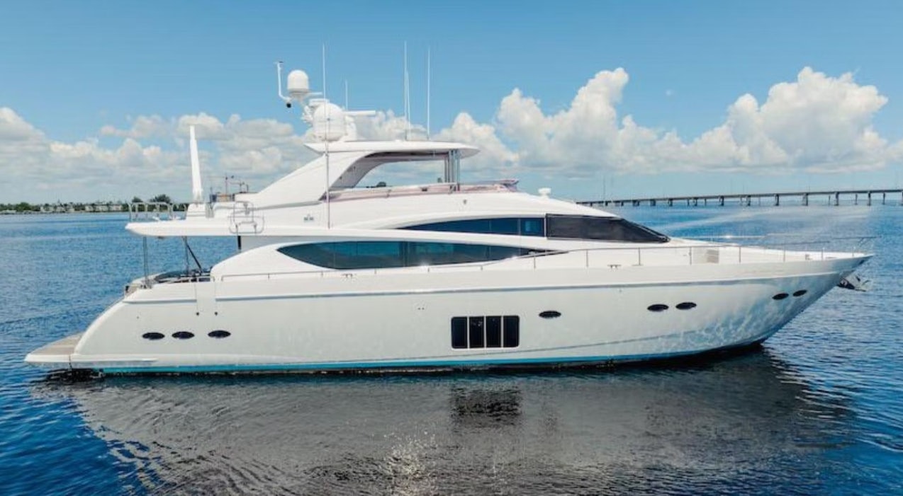 a white yacht on the water aboard VIXEN Yacht for Sale