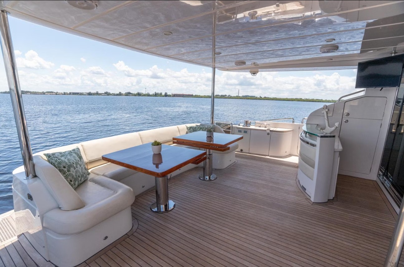 a room with a table and chairs aboard VIXEN Yacht for Sale
