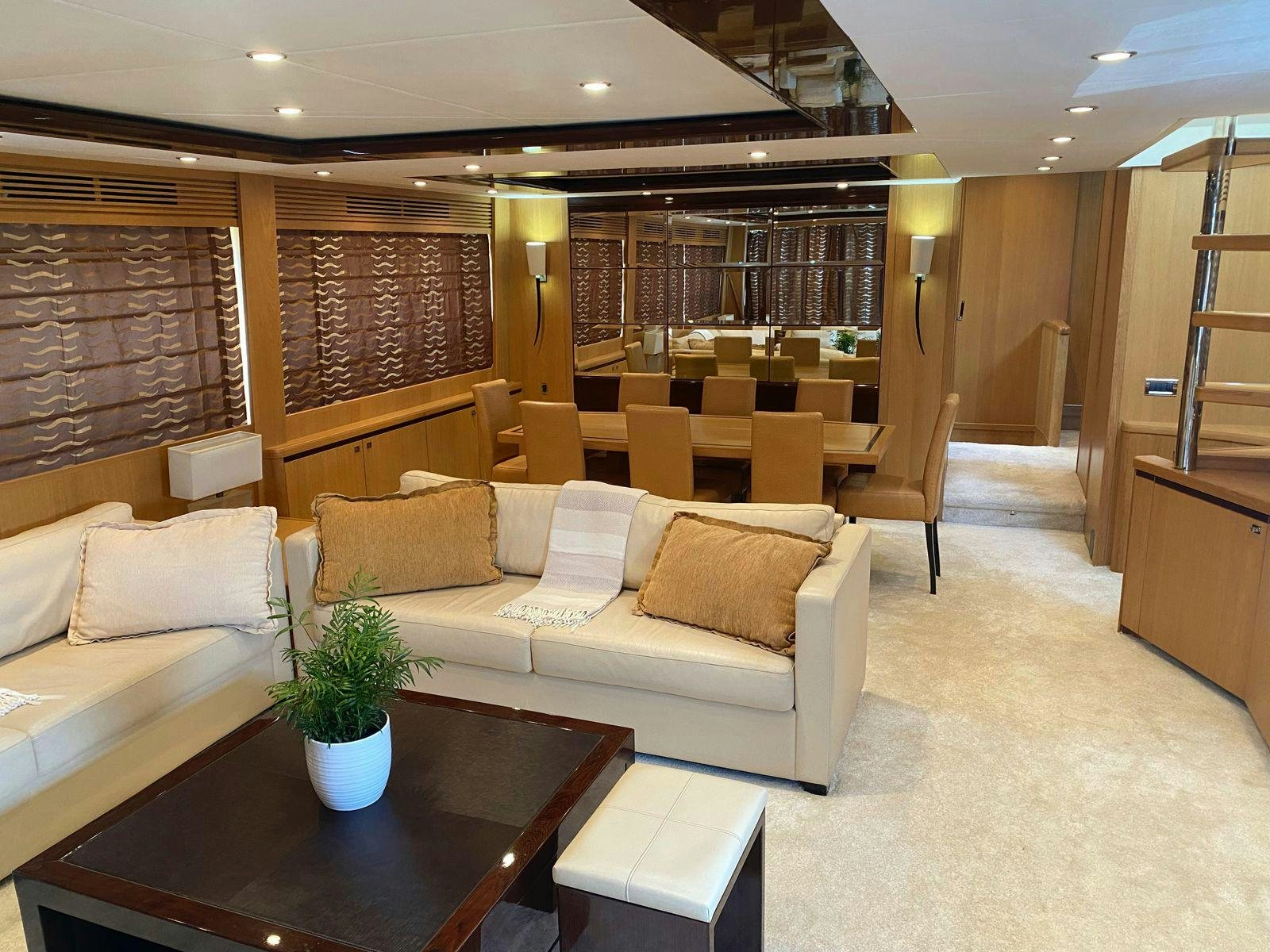 a living room with a couch and a coffee table aboard VIXEN Yacht for Sale