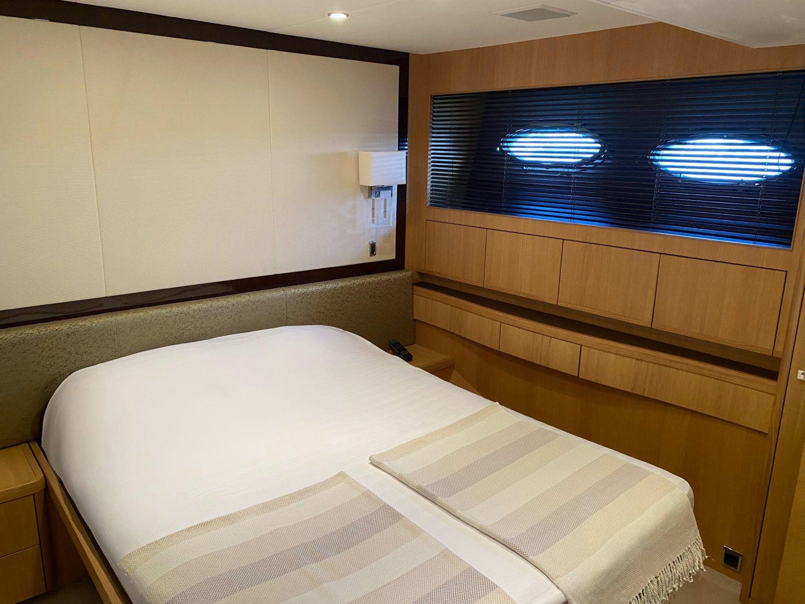 a bed with a white sheet aboard VIXEN Yacht for Sale