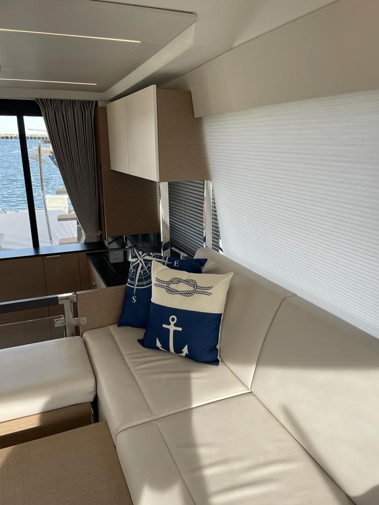 a room with a bed and a window aboard SEAS THE DAY Yacht for Sale