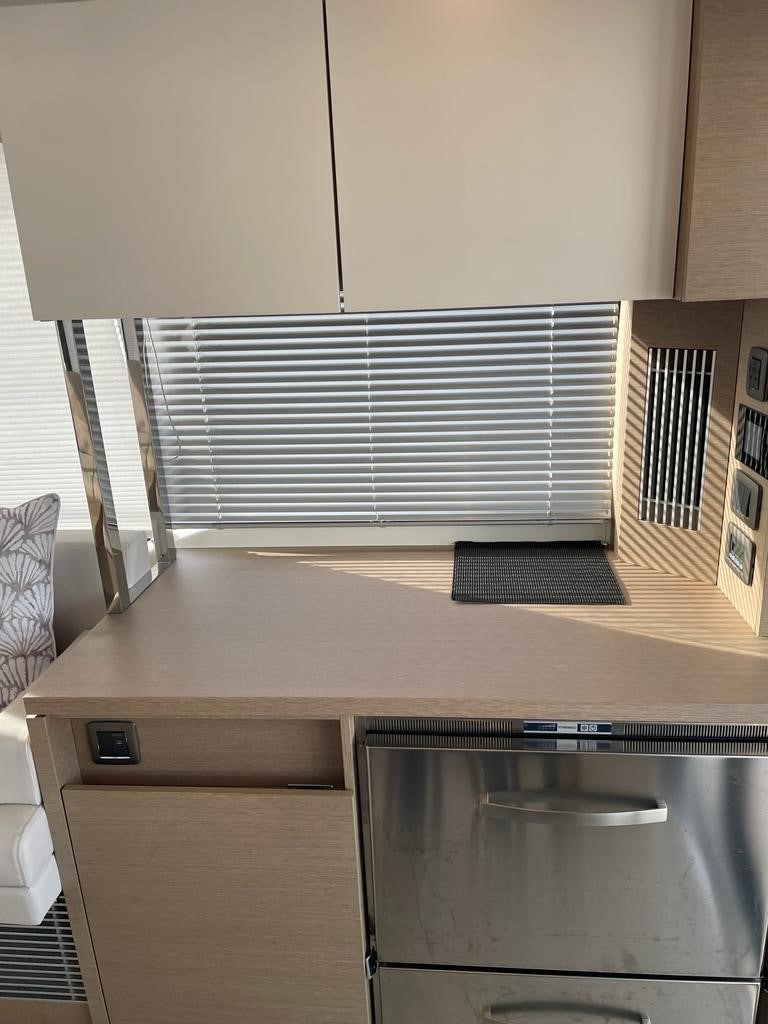 a kitchen with a steel stove aboard SEAS THE DAY Yacht for Sale