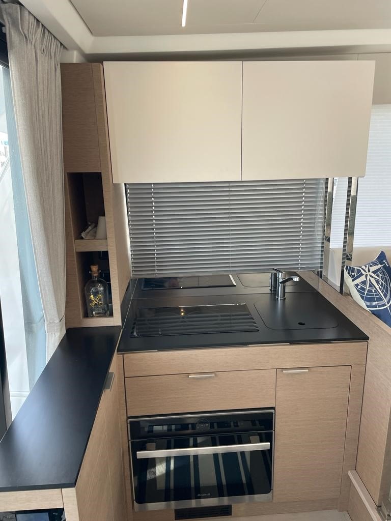 a kitchen with a stove and a sink aboard SEAS THE DAY Yacht for Sale