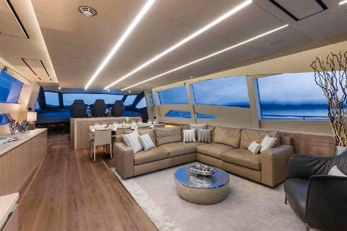 a living room with a large window aboard LEVANTINE II Yacht for Charter