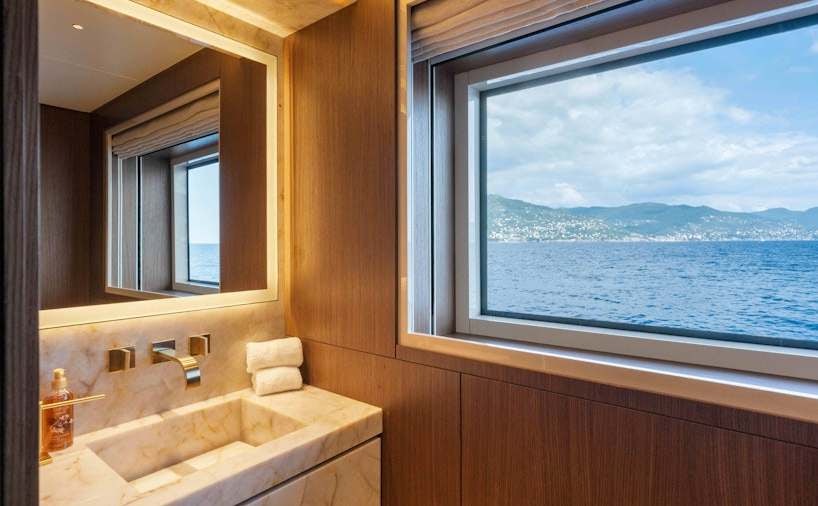 a bathroom with a large window aboard SERENISSIMA I Yacht for Charter