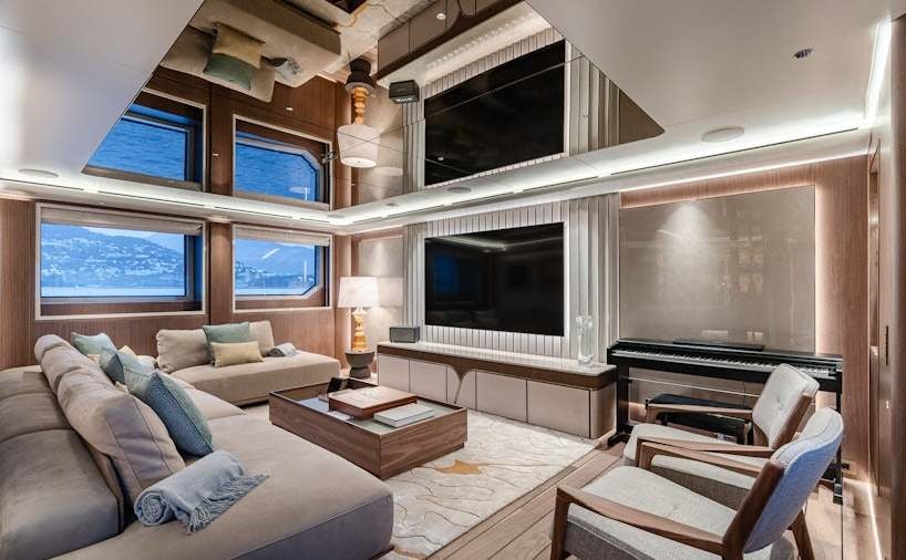 a living room with a large television aboard SERENISSIMA I Yacht for Charter