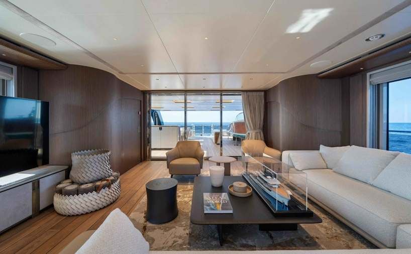 a living room with a large window aboard SERENISSIMA I Yacht for Charter