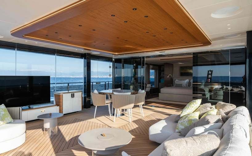 a living room with a large window aboard SERENISSIMA I Yacht for Charter