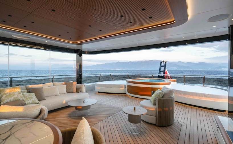 a living room with a large balcony aboard SERENISSIMA I Yacht for Charter