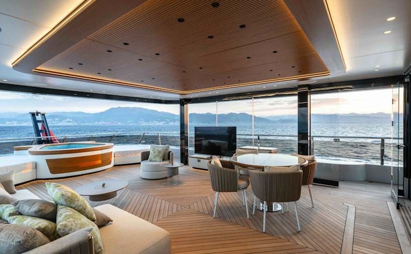 a room with a table and chairs aboard SERENISSIMA I Yacht for Charter