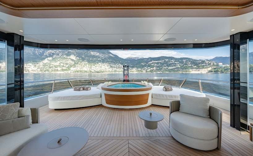 a room with a large window and a view of a city aboard SERENISSIMA I Yacht for Charter