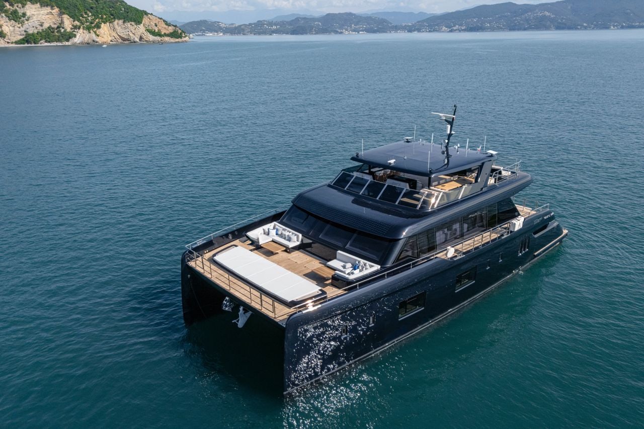 a large ship in the water aboard PETITE BELLE Yacht for Sale