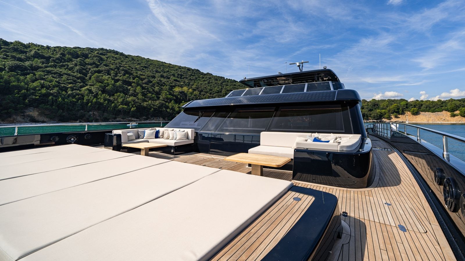 a large boat on a deck aboard PETITE BELLE Yacht for Sale