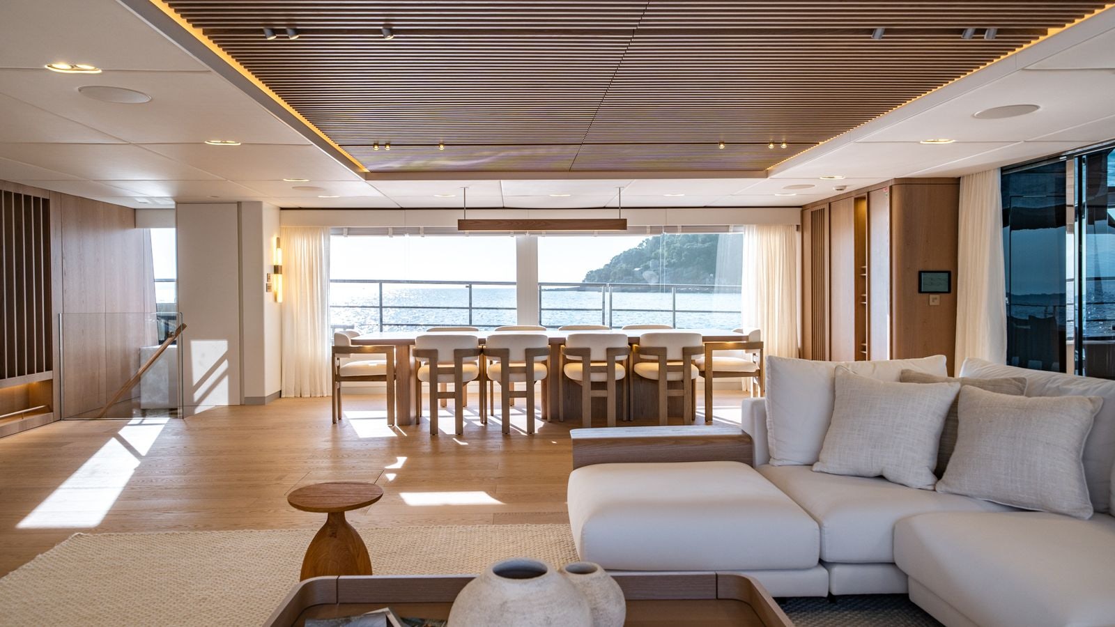 a living room with a large window aboard PETITE BELLE Yacht for Sale