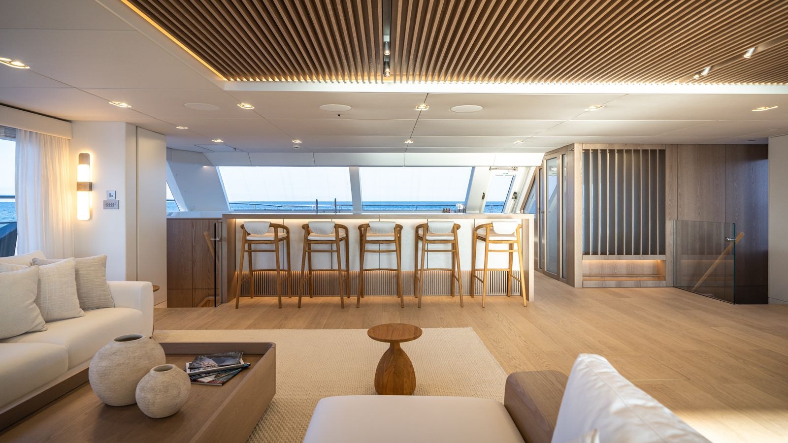 a living room with a large window aboard PETITE BELLE Yacht for Sale