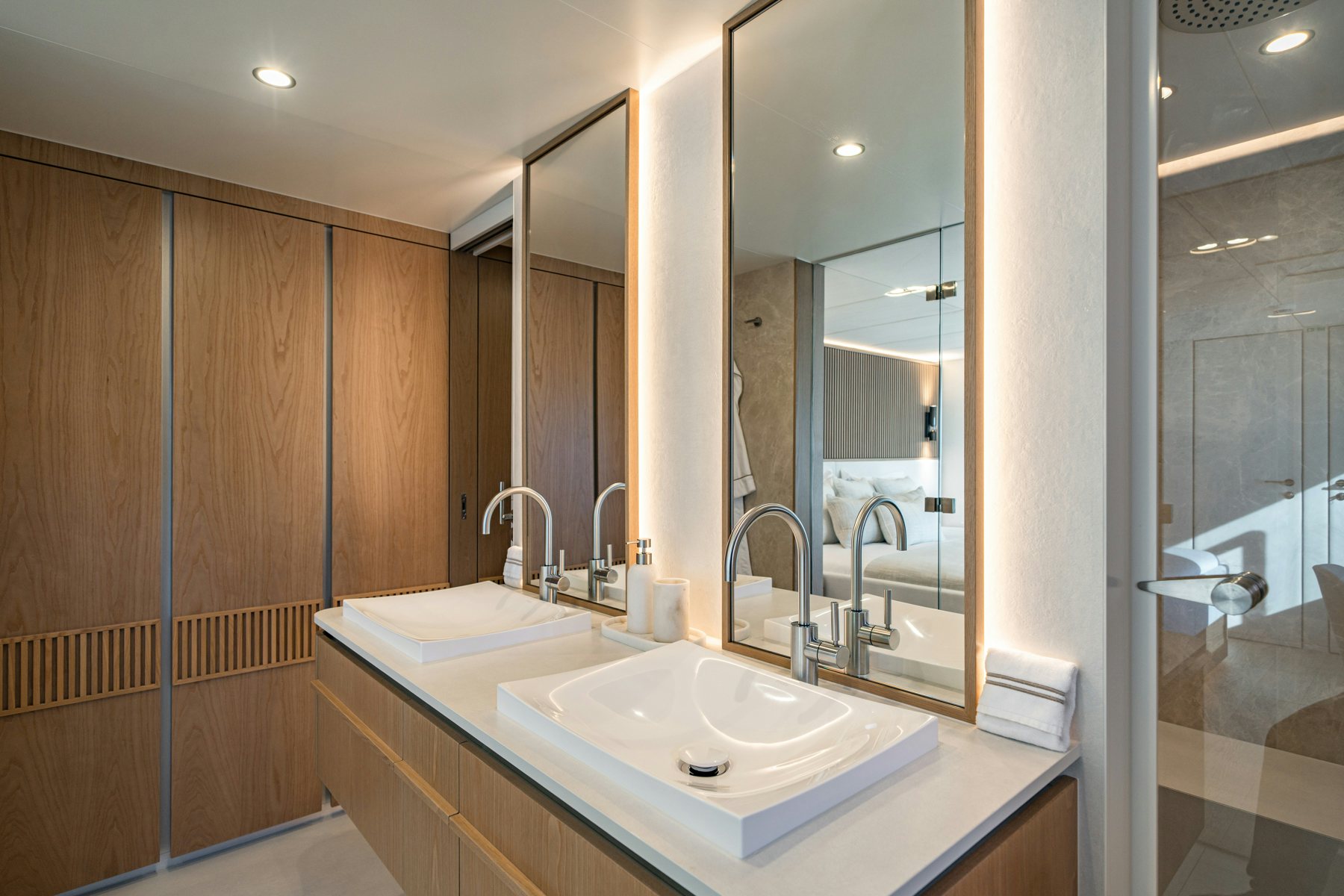 a bathroom with a sink and a mirror aboard PETITE BELLE Yacht for Sale