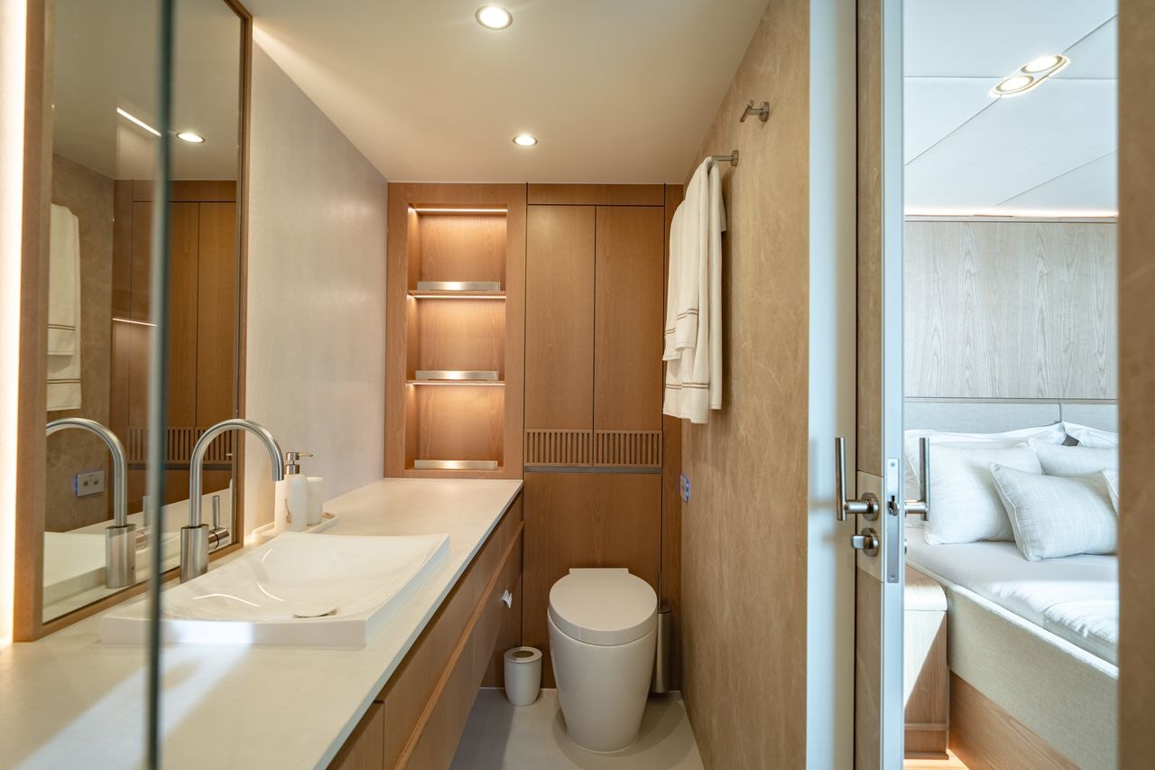 a bathroom with a sink and a toilet aboard PETITE BELLE Yacht for Sale