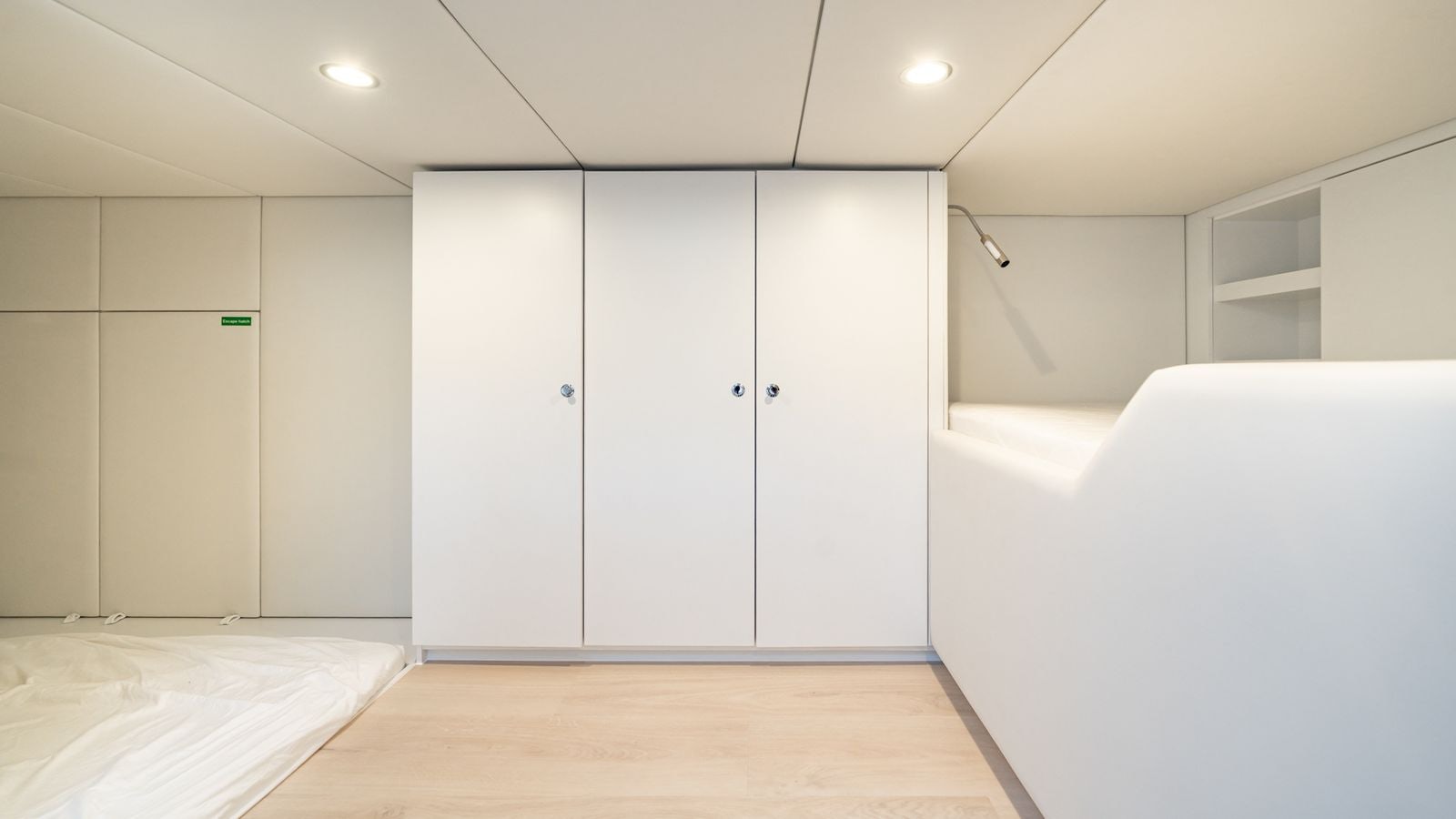 a room with white doors aboard PETITE BELLE Yacht for Sale