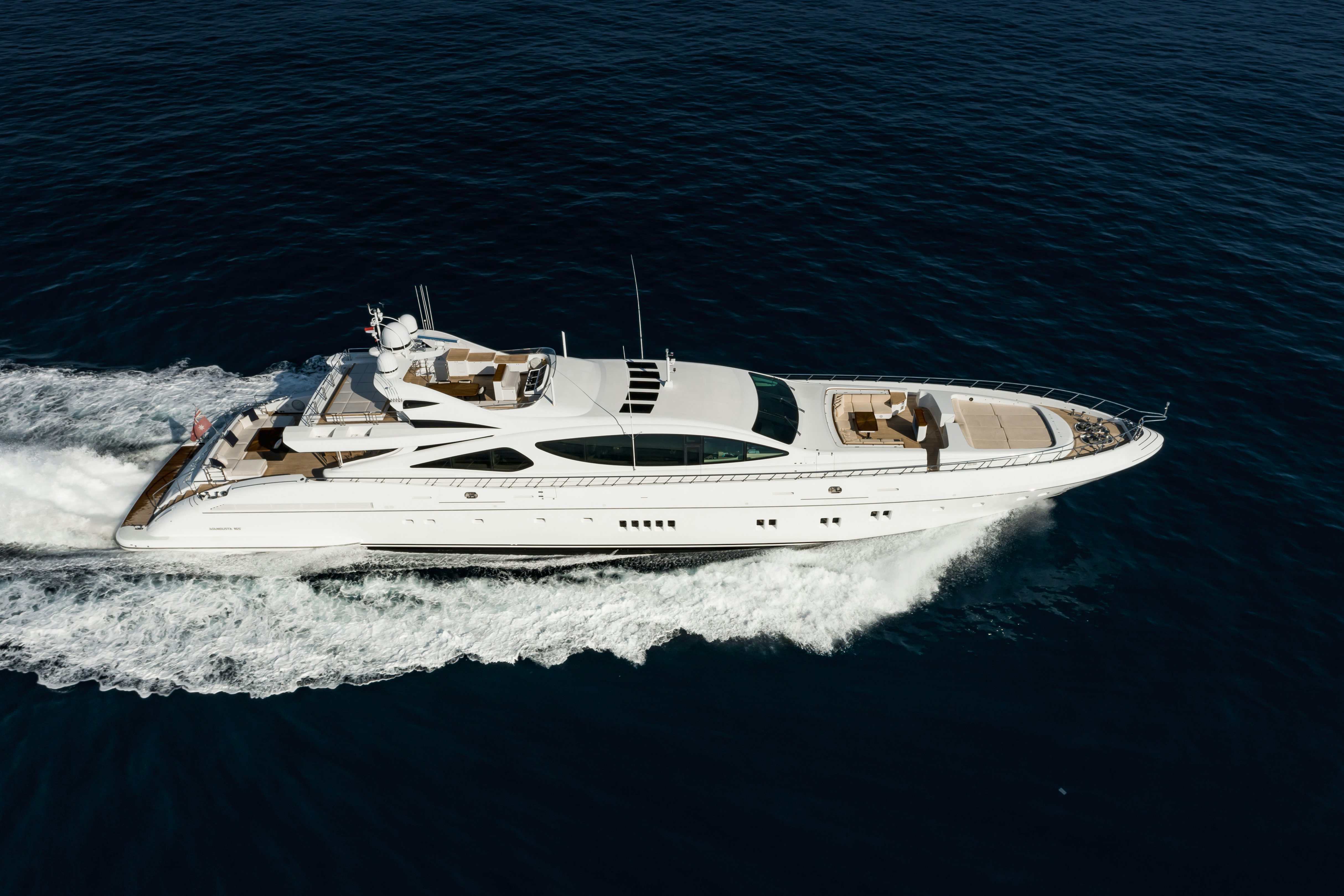 a white yacht on the water aboard ROYALE X Yacht for Charter