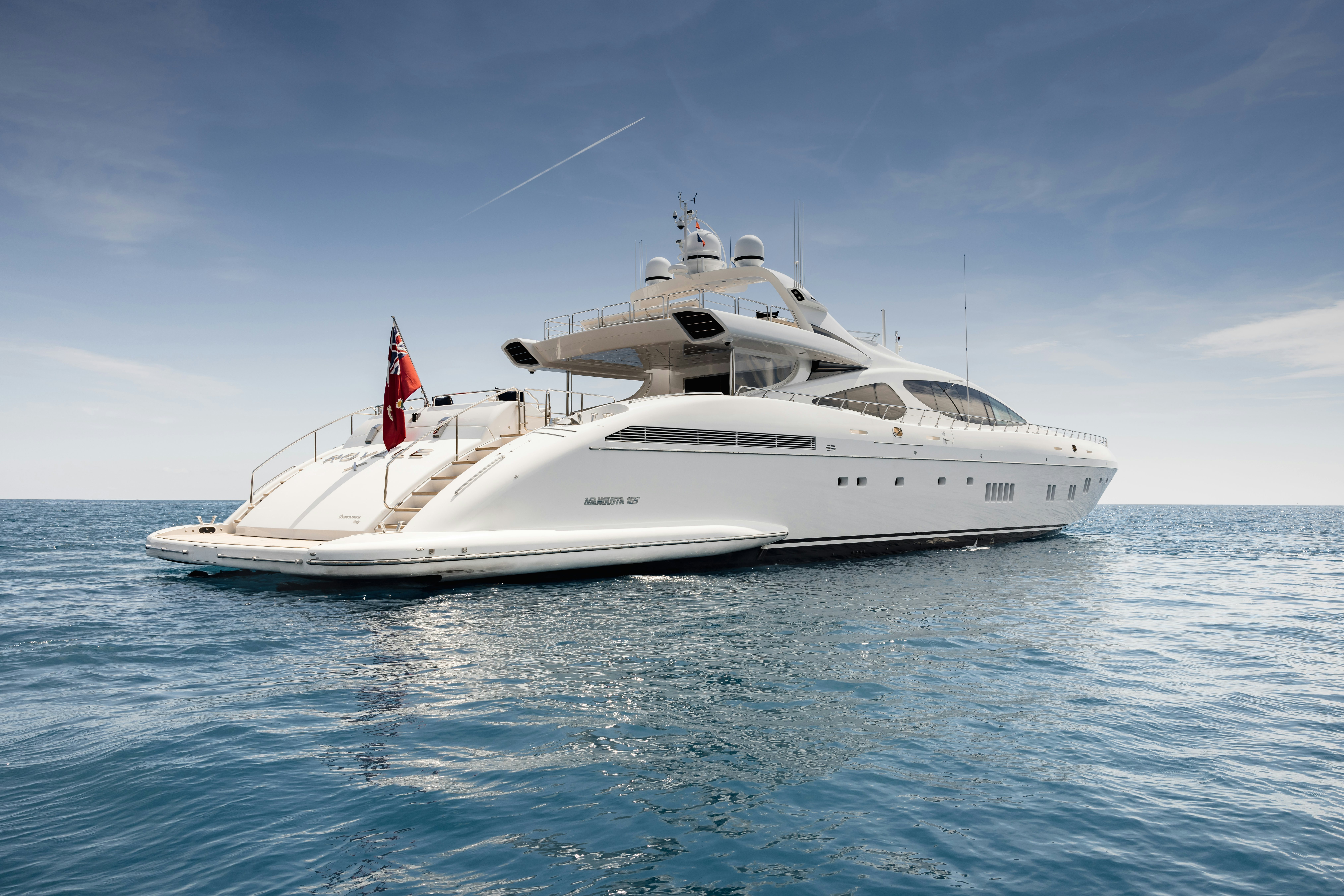 a white yacht in the water aboard ROYALE X Yacht for Charter