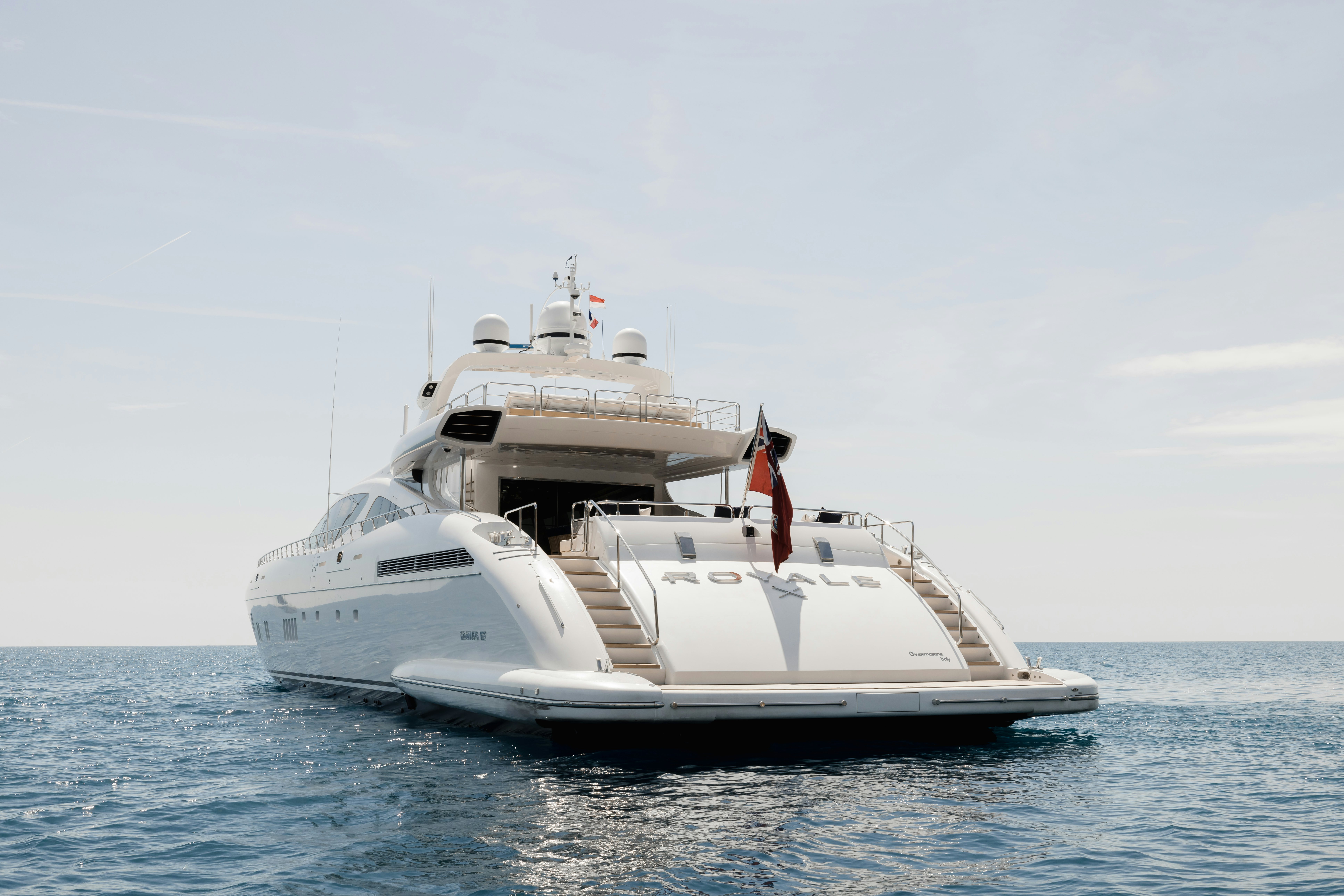 a white boat in the water aboard ROYALE X Yacht for Charter