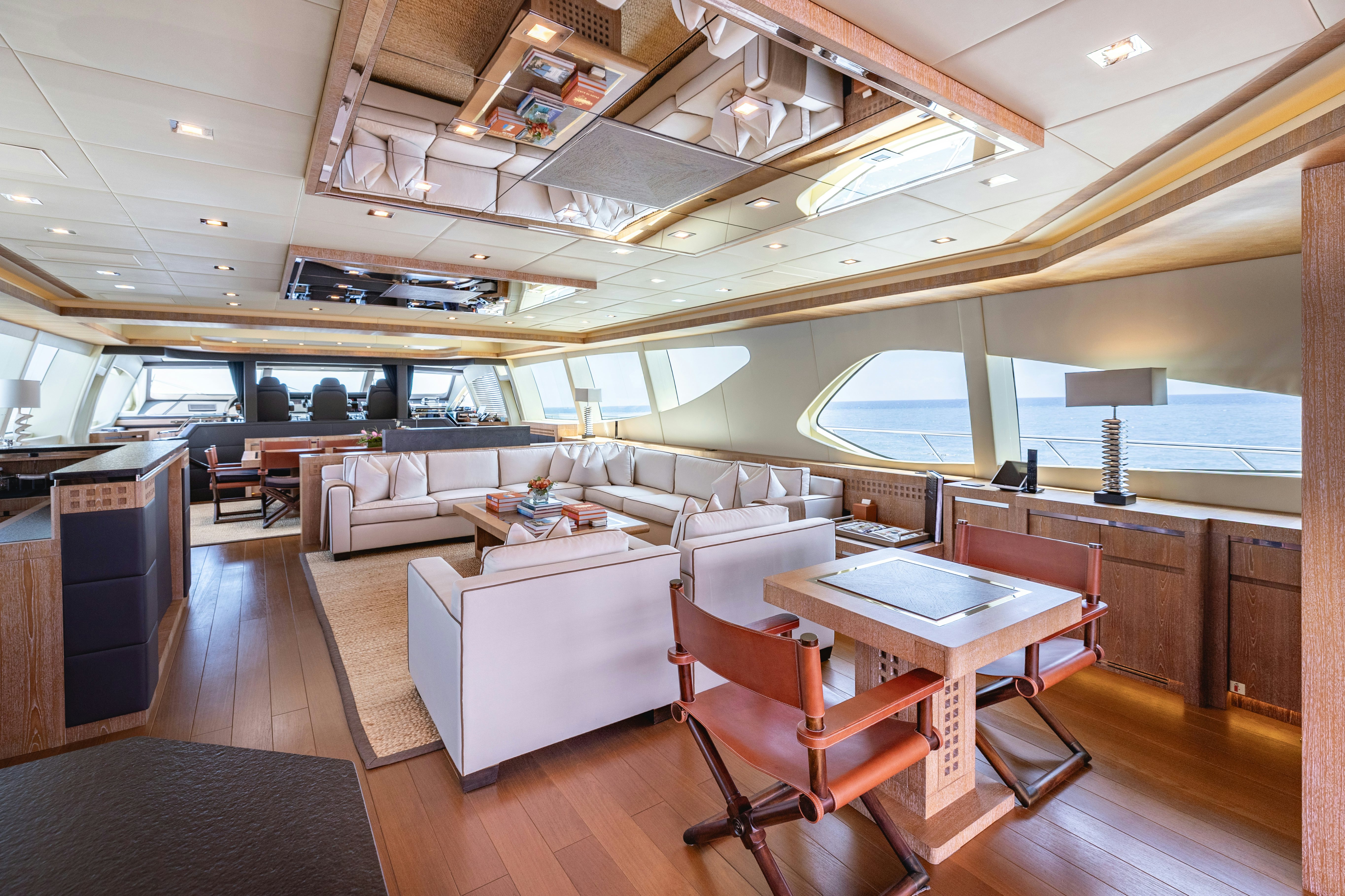 a room with a table and chairs aboard ROYALE X Yacht for Charter