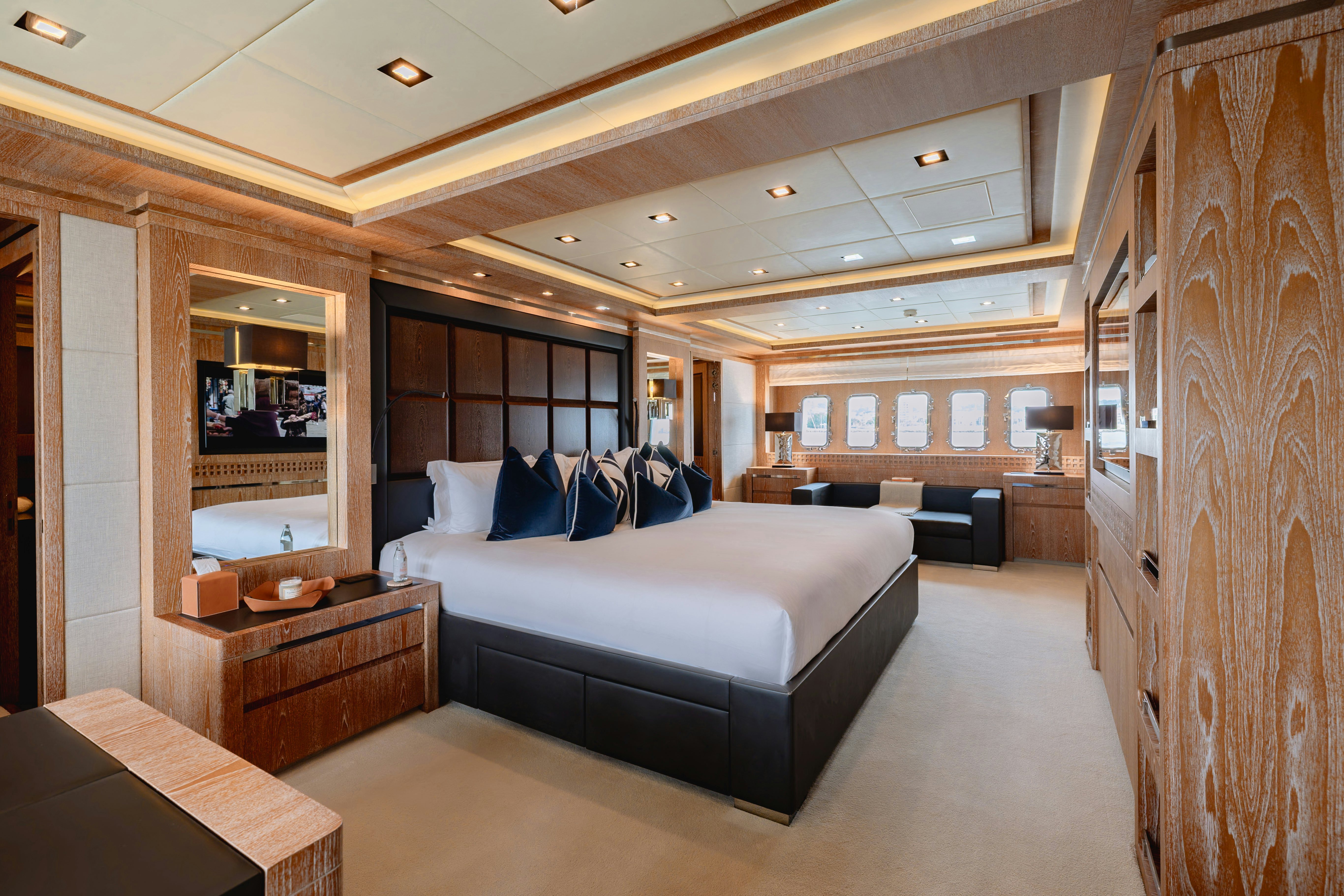 a large bedroom with a bed aboard ROYALE X Yacht for Charter