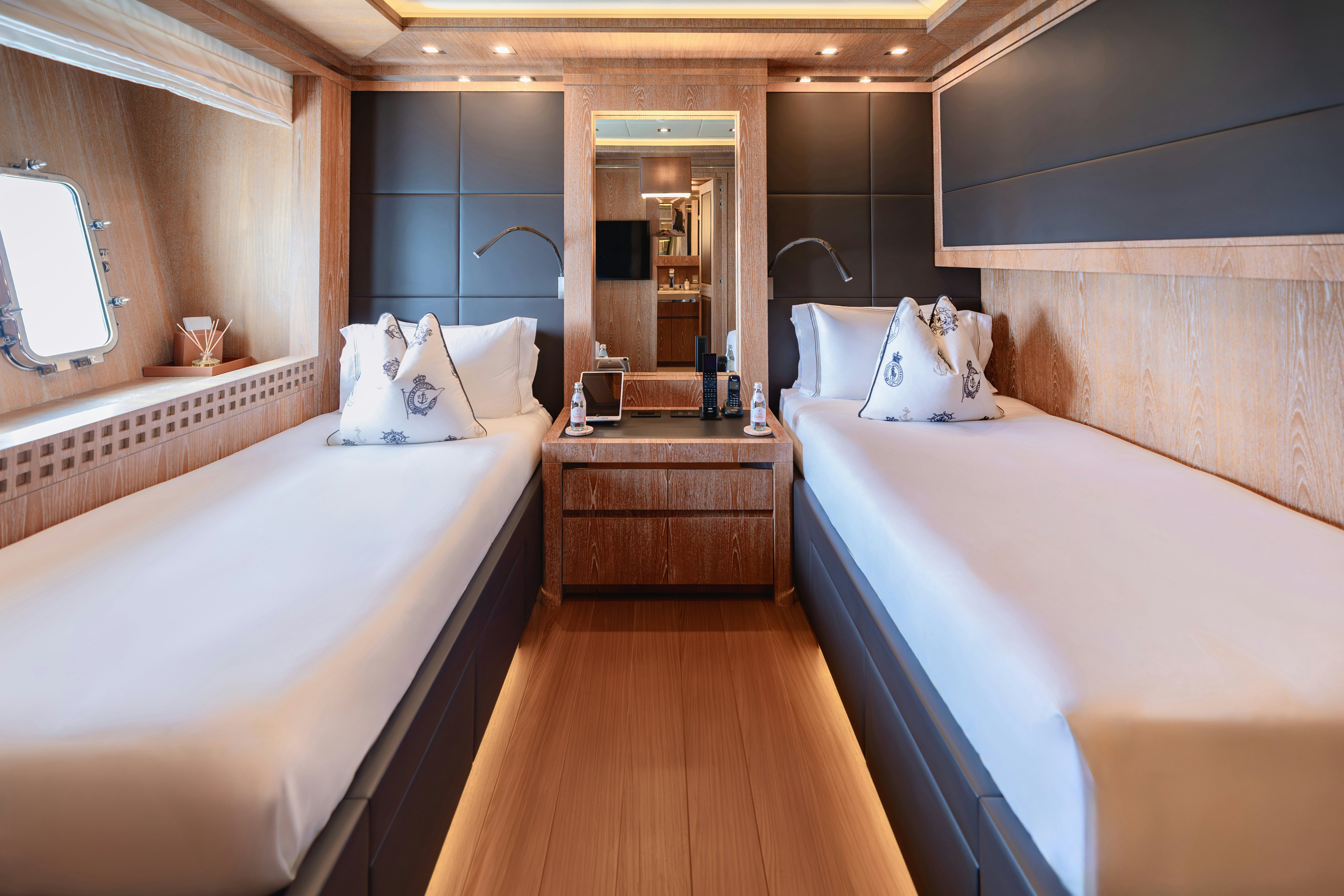 a hotel room with a large mirror aboard ROYALE X Yacht for Charter