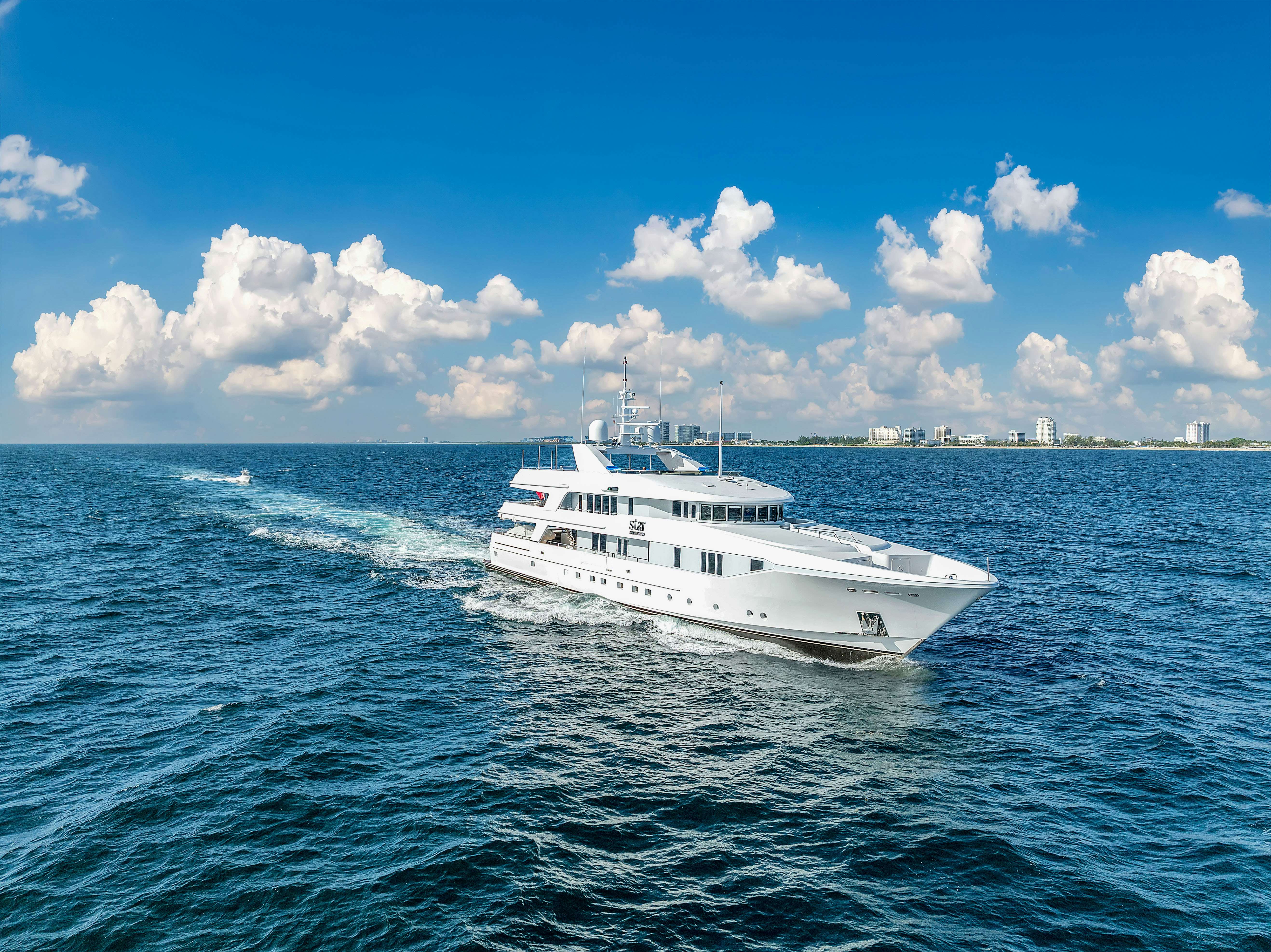 a white boat on the water aboard STAR DIAMOND Yacht for Sale