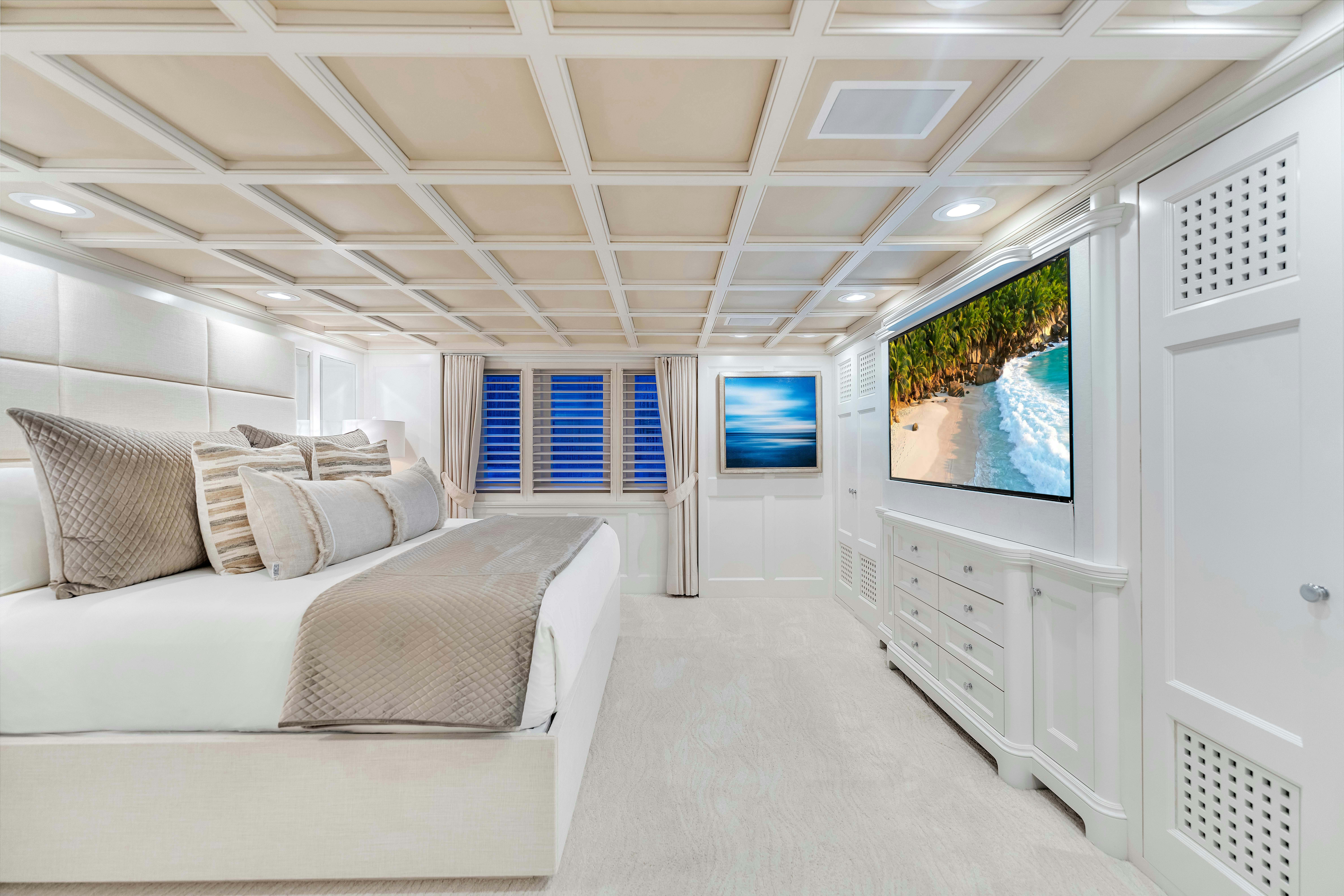 a room with a bed and a television aboard STAR DIAMOND Yacht for Charter