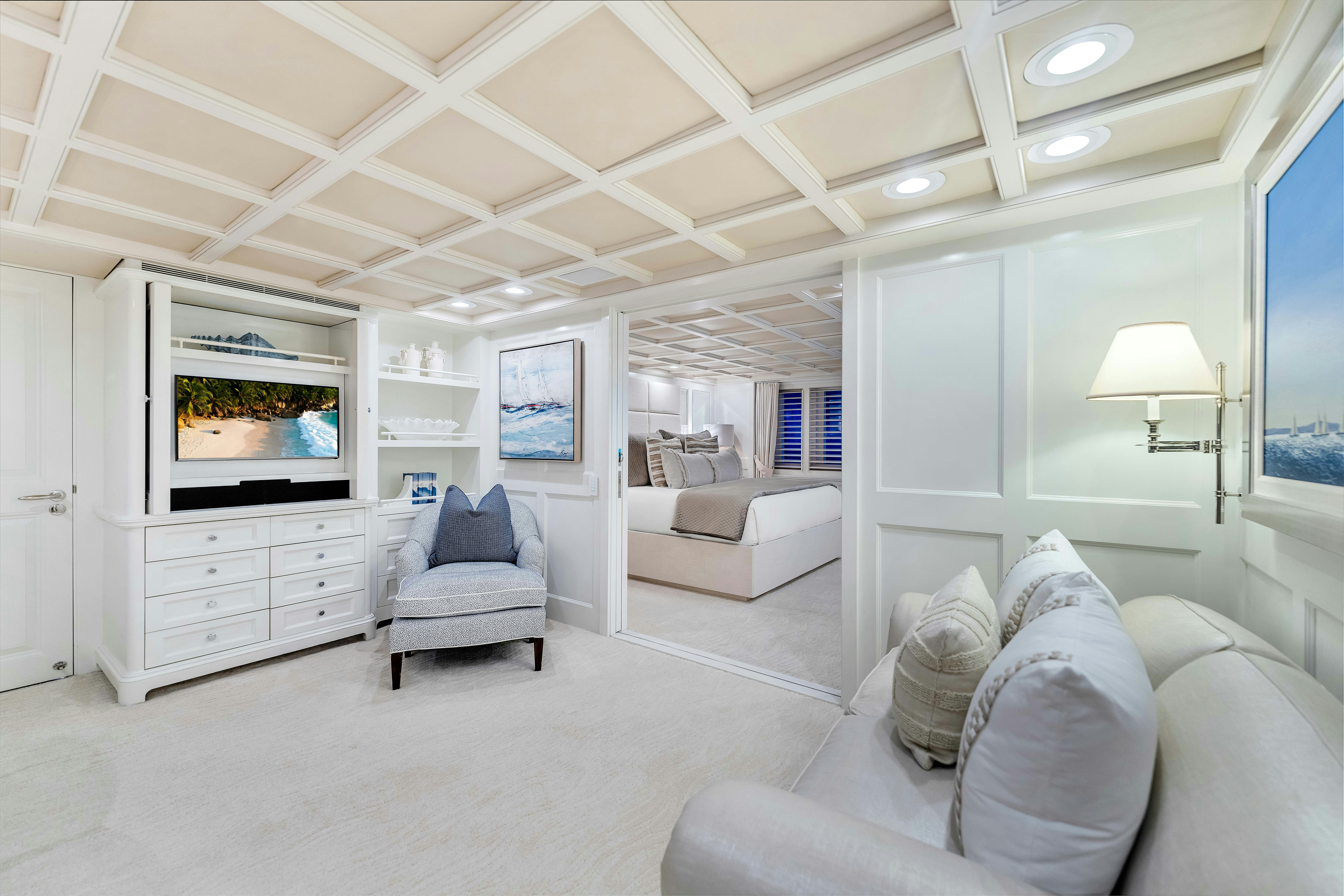 a living room with white furniture aboard STAR DIAMOND Yacht for Sale