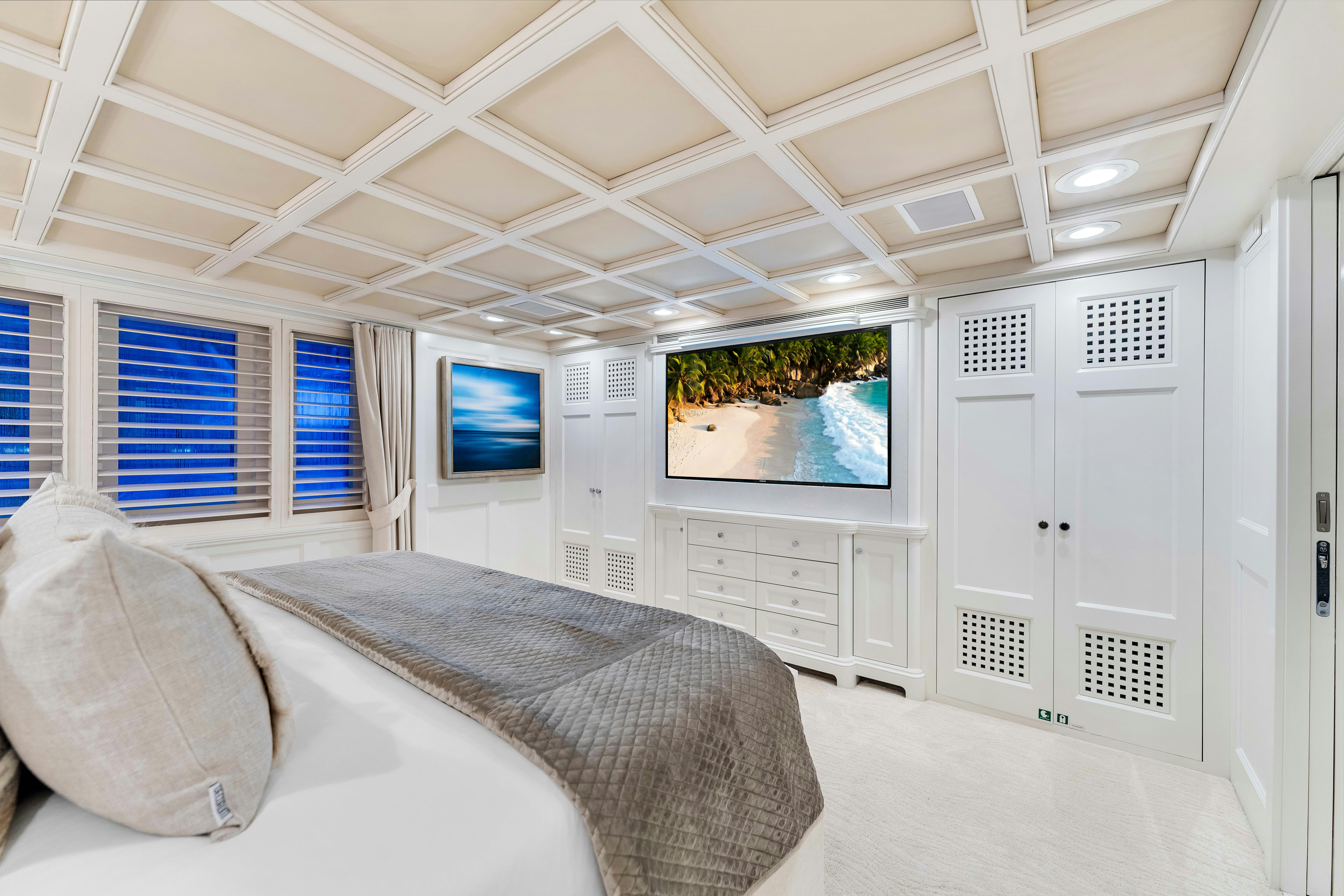 a room with a couch and a tv on the wall aboard STAR DIAMOND Yacht for Sale