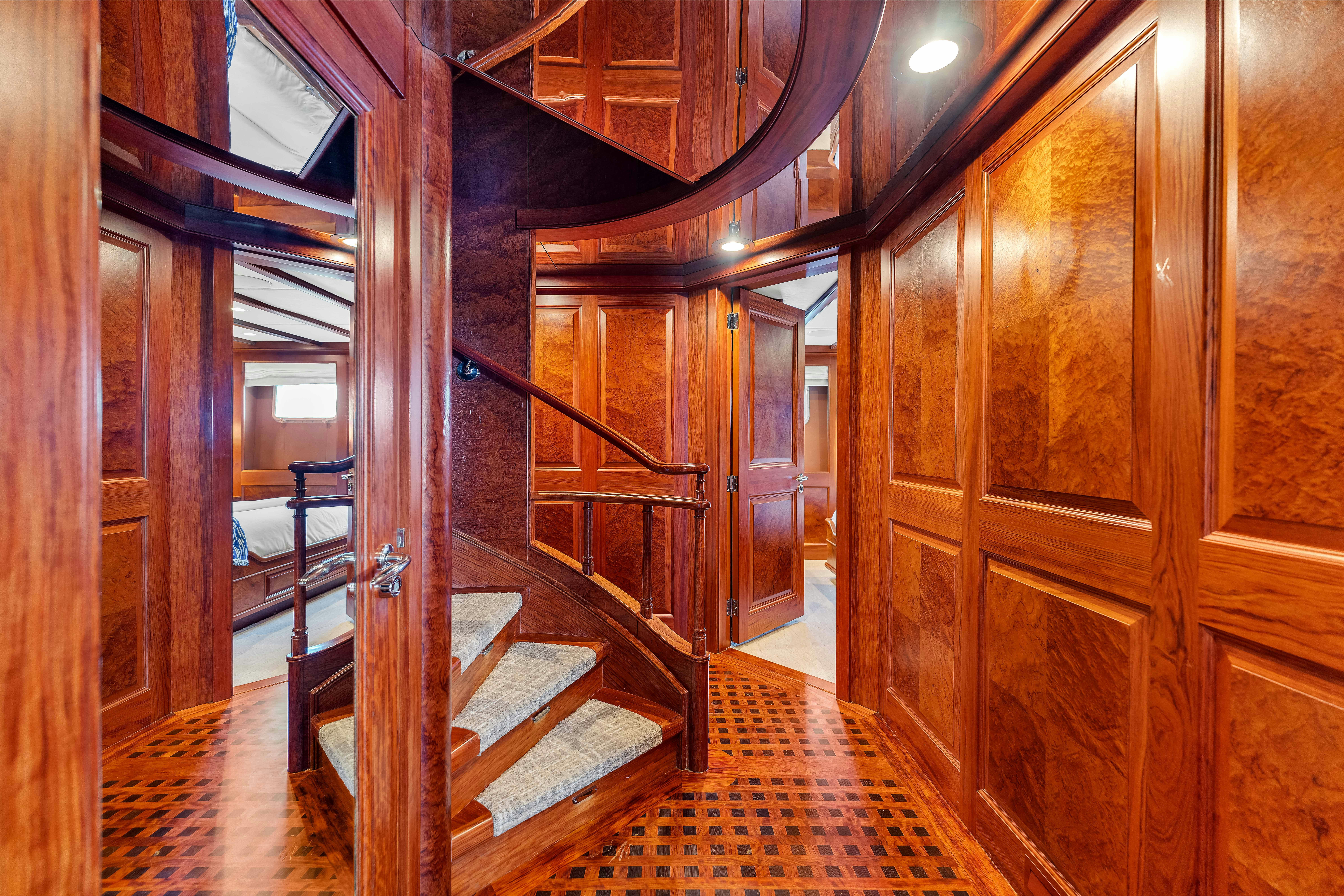 a room with wooden doors aboard STAR DIAMOND Yacht for Charter
