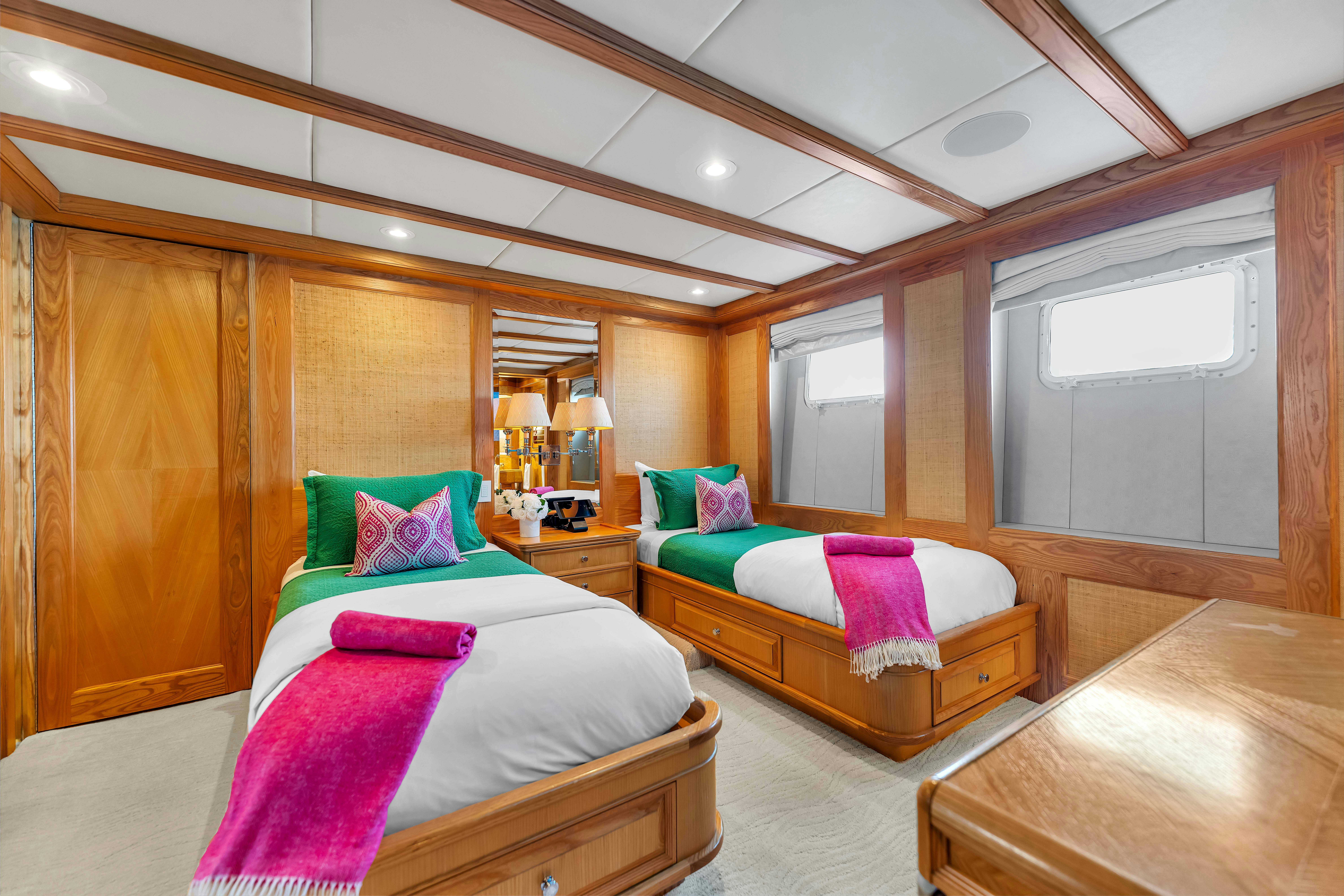 a room with a couple beds aboard STAR DIAMOND Yacht for Charter