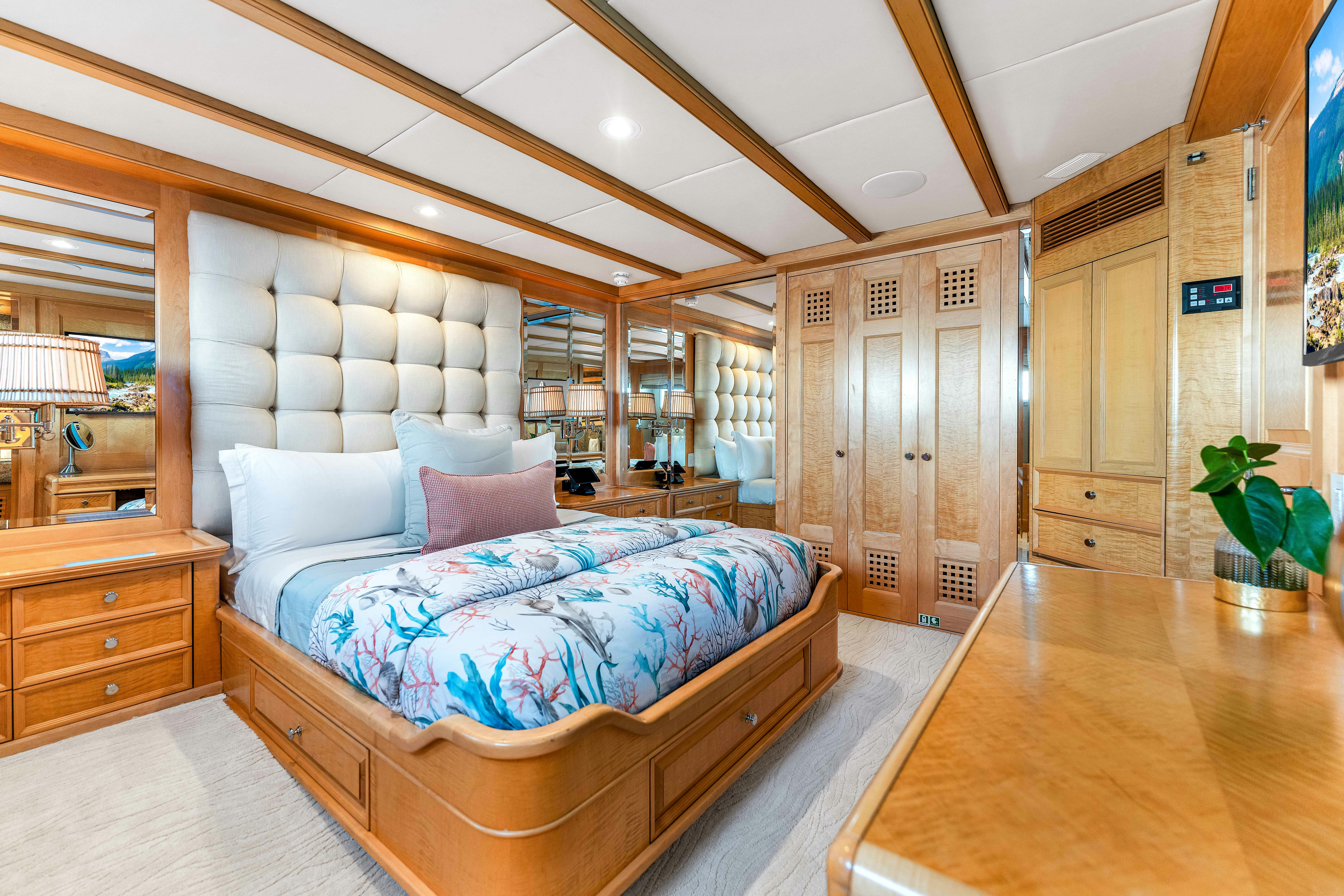 a large bedroom with a bed aboard STAR DIAMOND Yacht for Charter