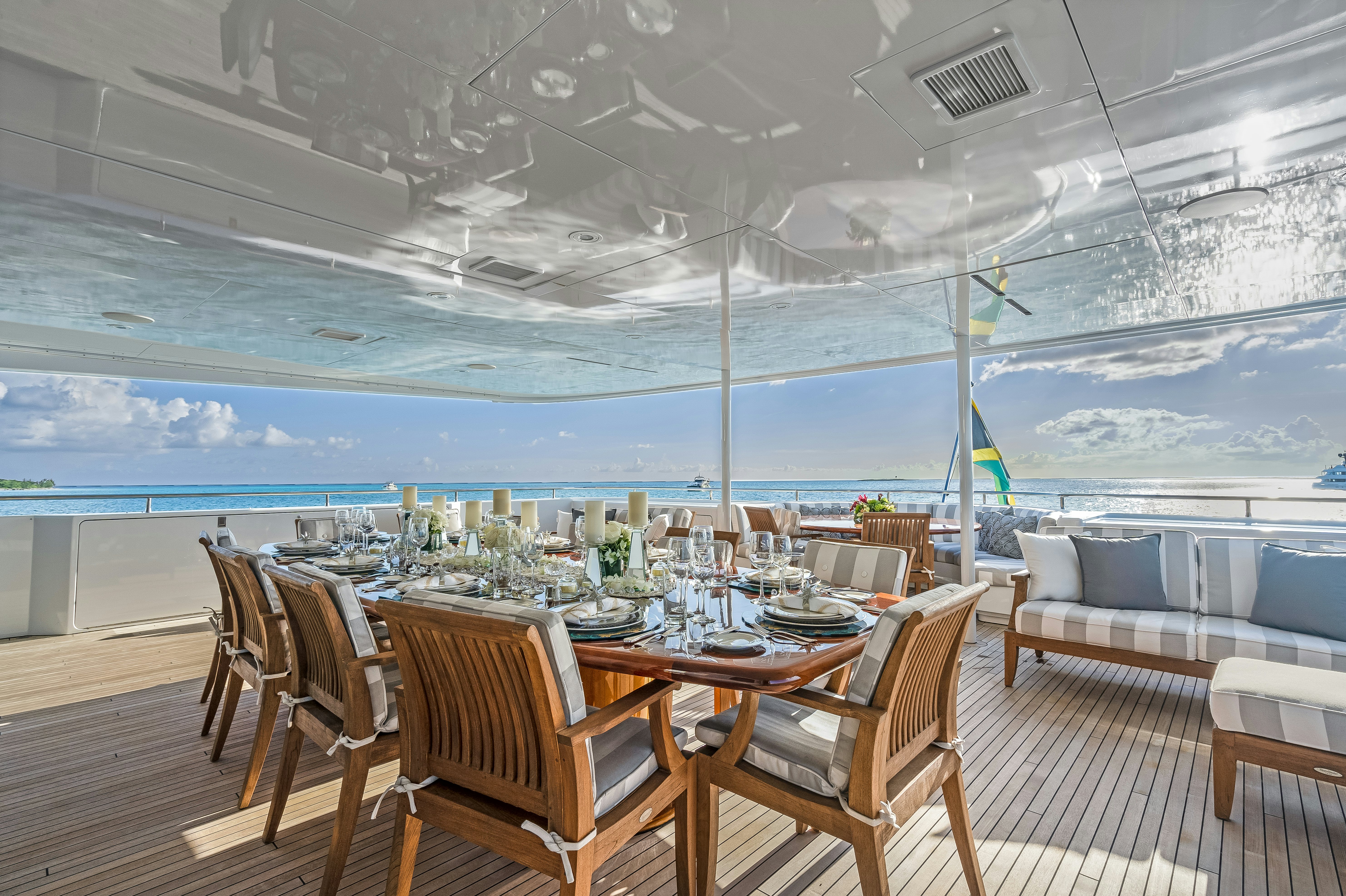 a room with a table and chairs aboard STAR DIAMOND Yacht for Charter