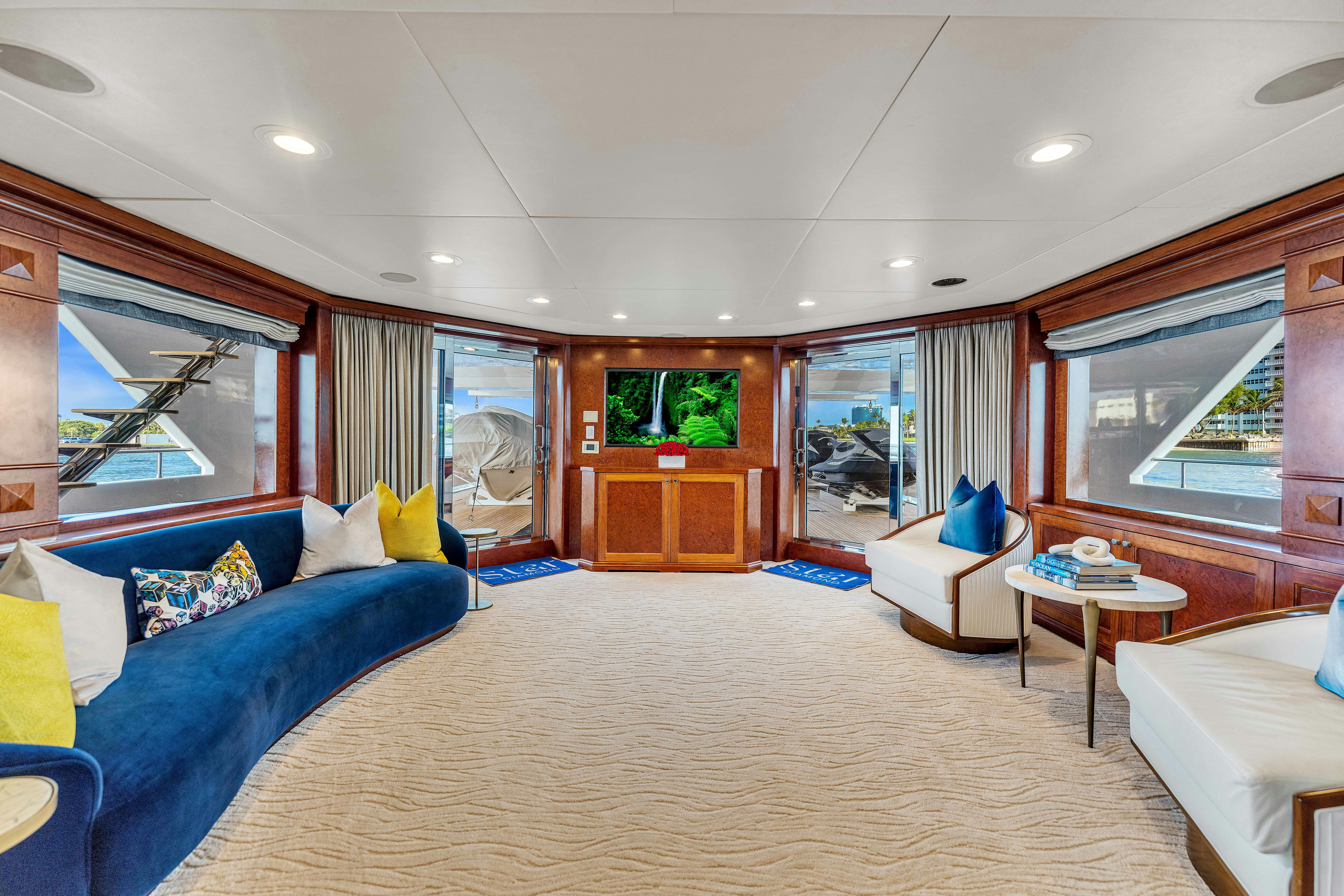 a living room with a large window aboard STAR DIAMOND Yacht for Charter