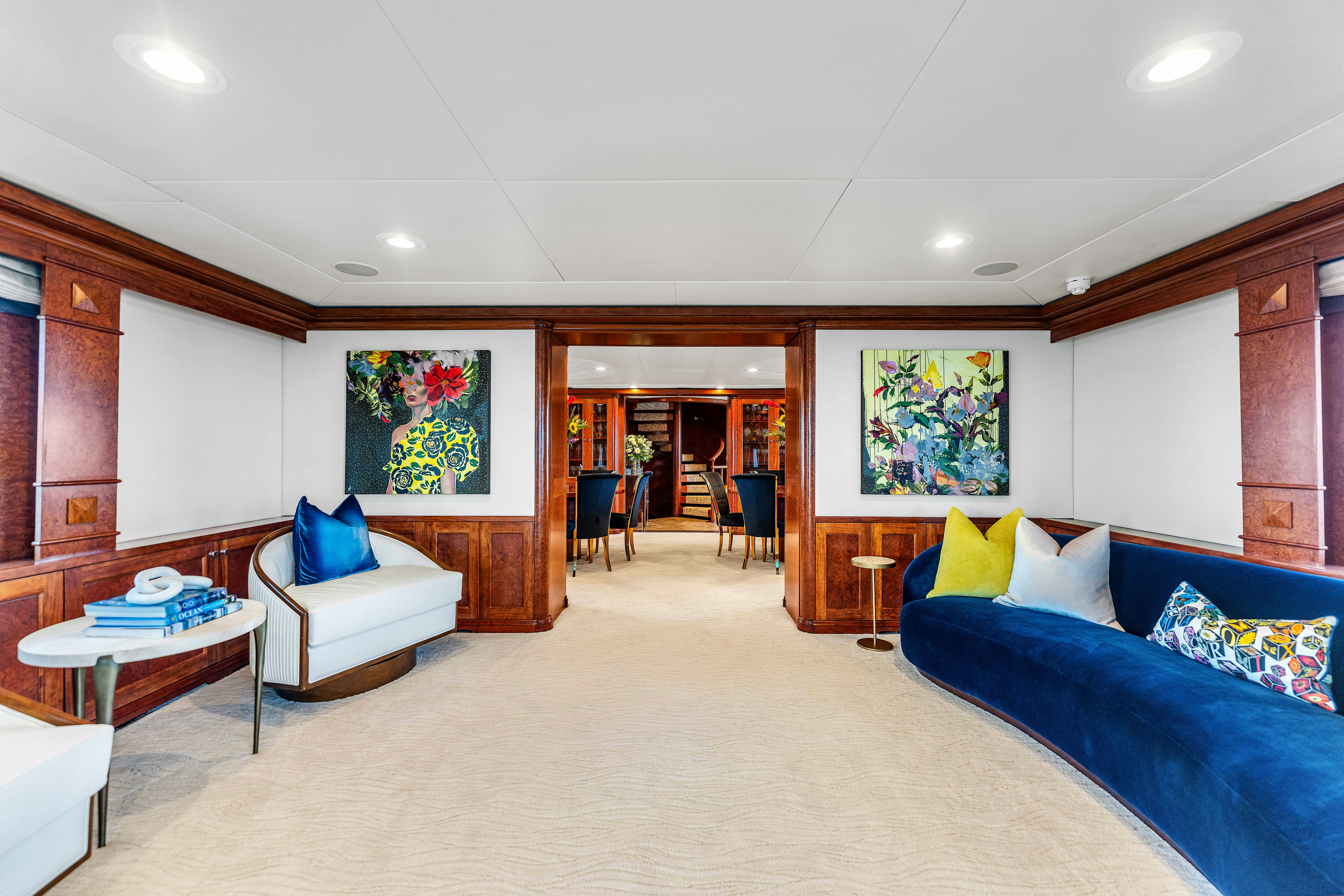 a living room with a couch and a table aboard STAR DIAMOND Yacht for Charter