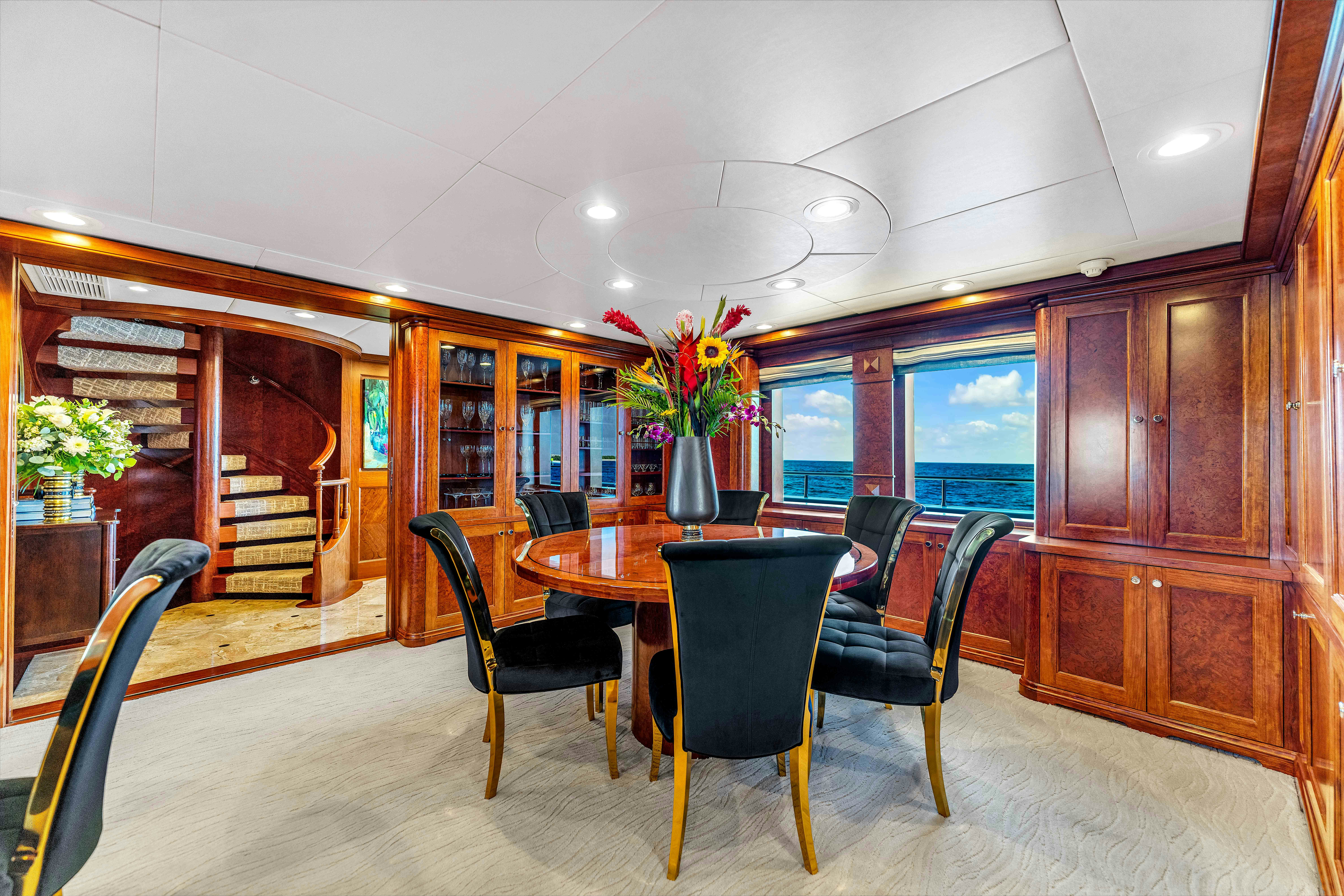 a dining room with a table and chairs aboard STAR DIAMOND Yacht for Charter